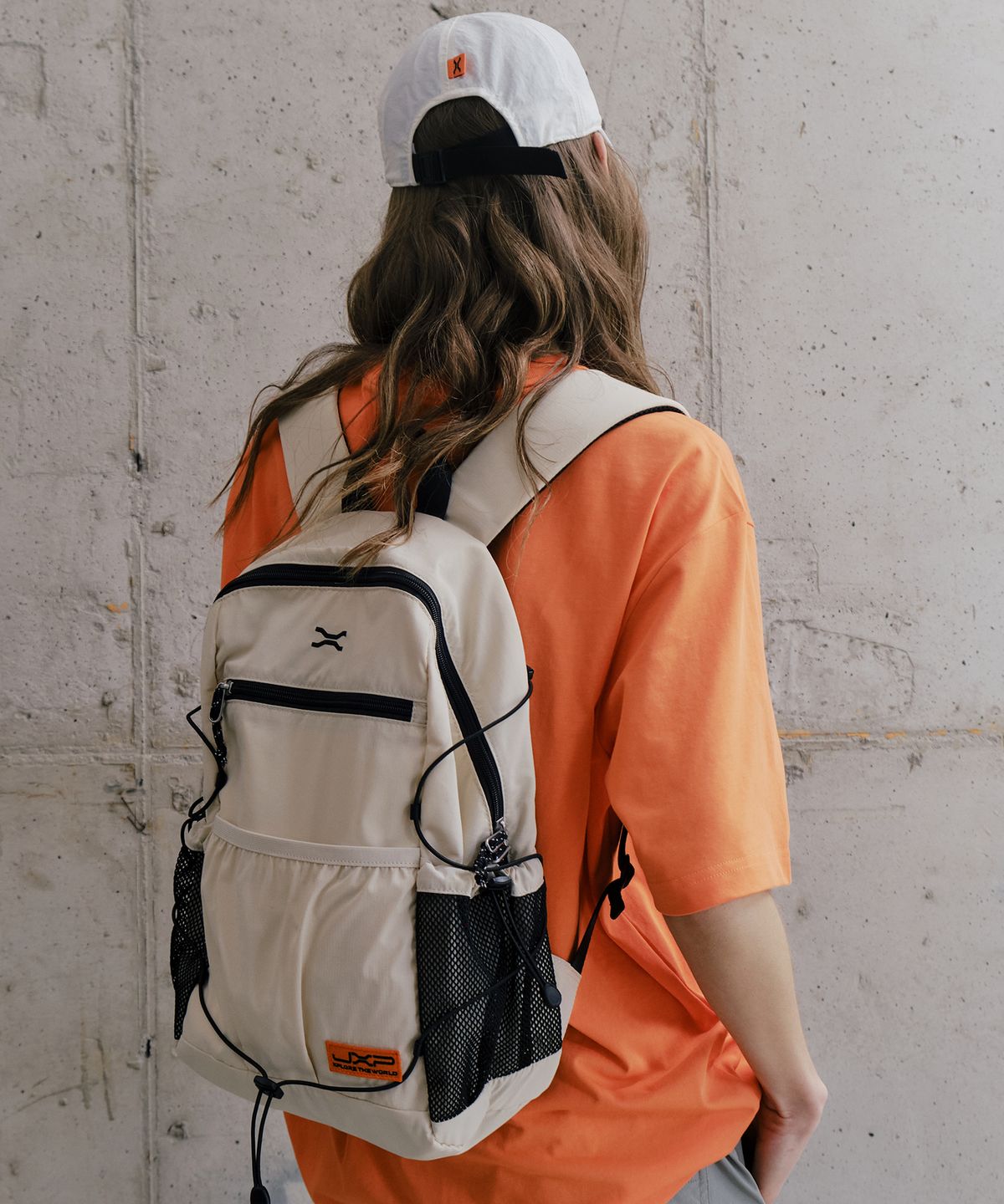 제이엑스피(JXP) Exposed Zipper Mesh Pocket Backpack (JR0GAU071IV)