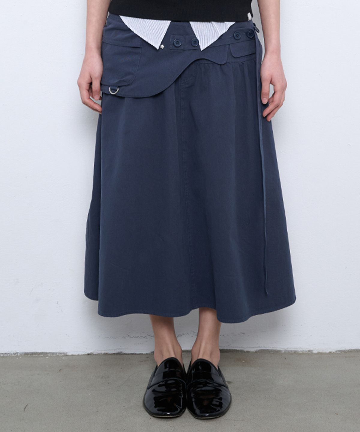 뚜오미오(TUOMIO) WASHED BELT BAG SKIRT [NAVY]