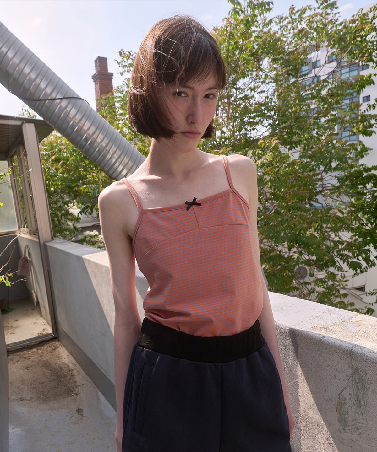 노컨텐츠(NOCONTENT) 348. 팝 스트라이프 슬리브리스 _ 오렌지