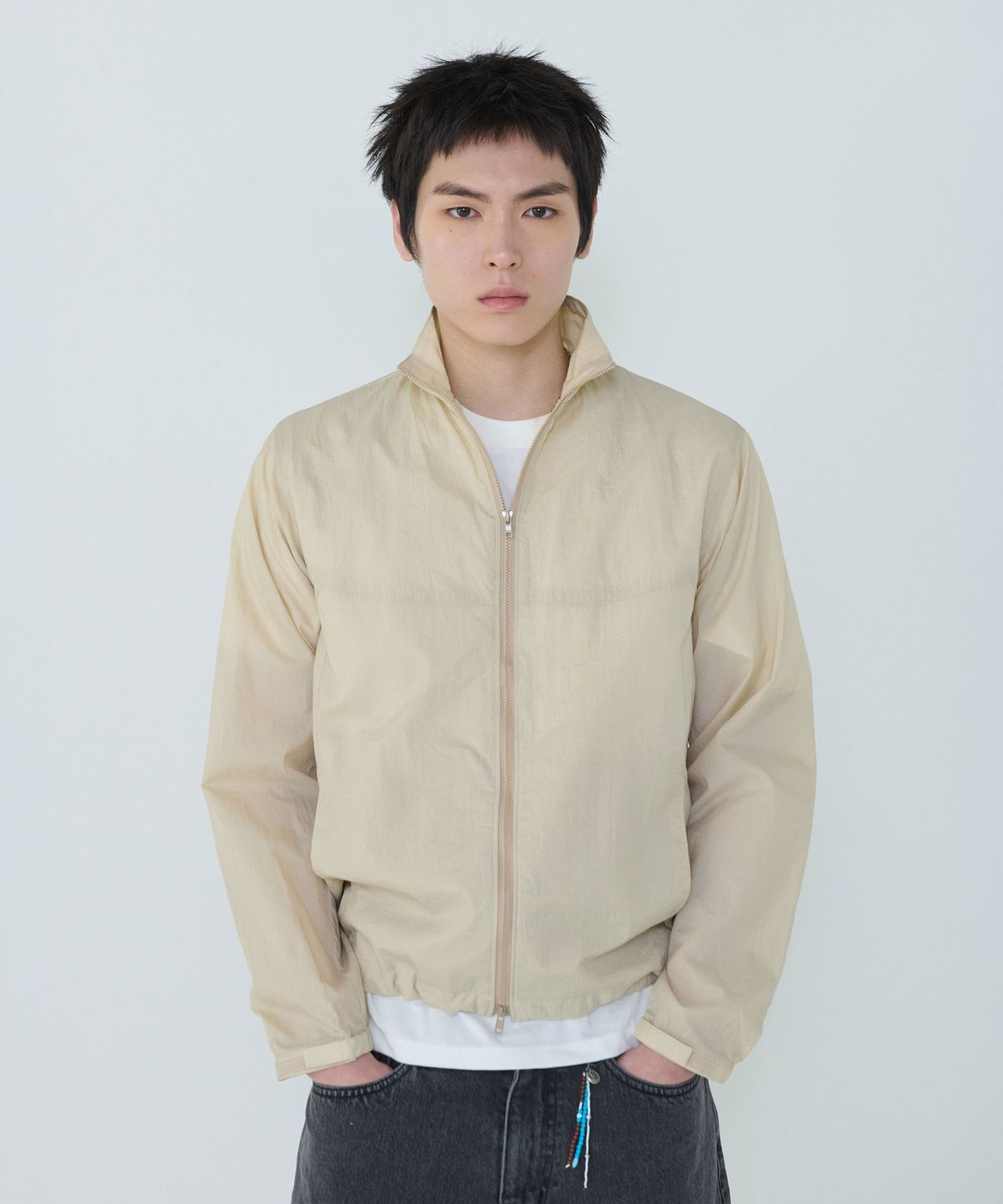 더씽인데어데어(THE THING IN THEIR THERE) Adaptive Nylon Jacket Sand