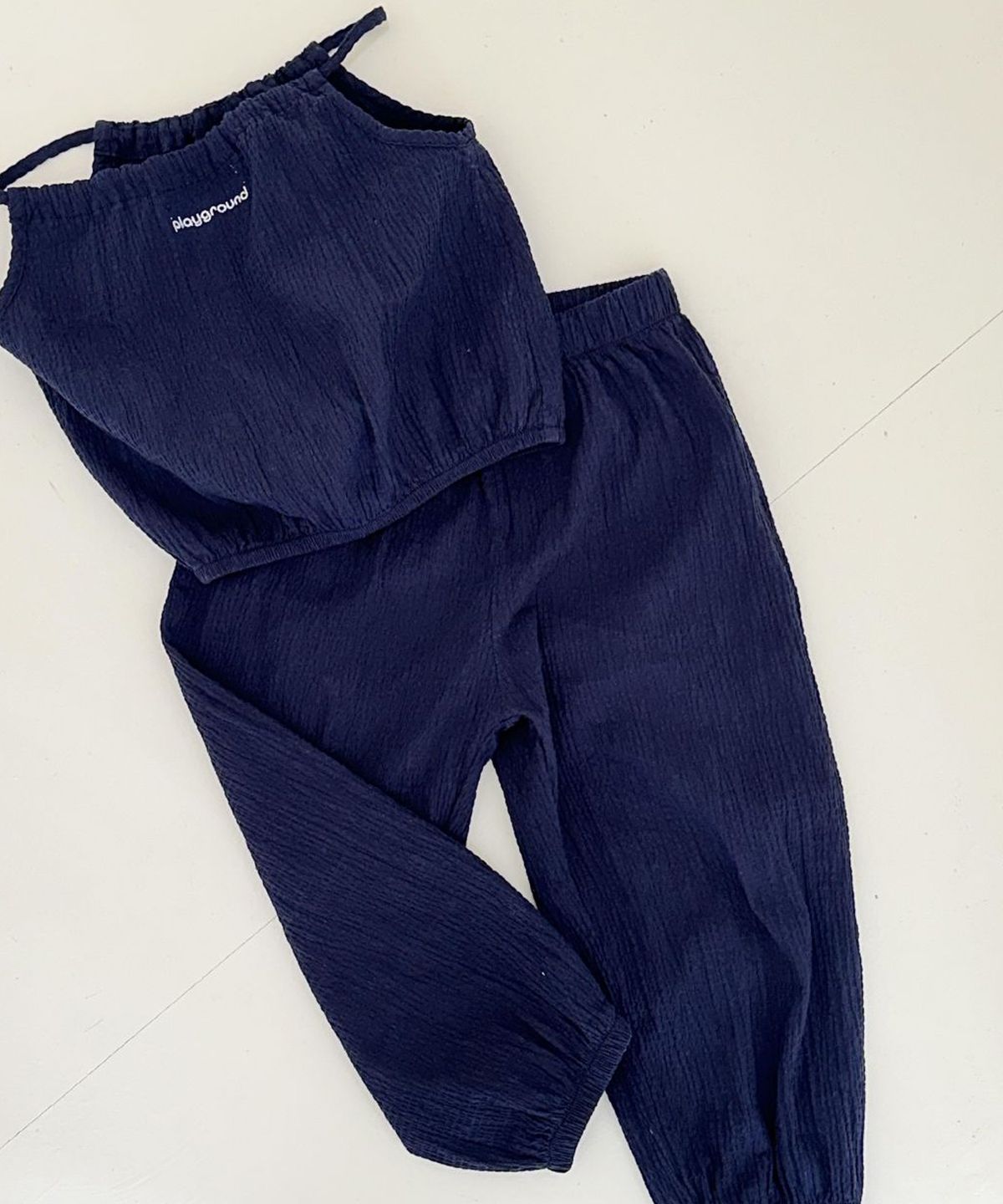 플레이그라운드(PLAYGROUND) Slide Set (Halter Neck Top & Jogger Pants)