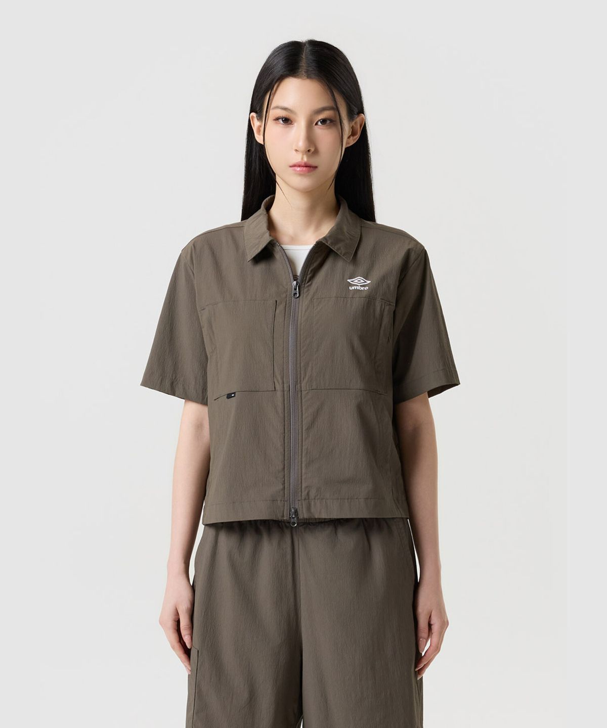 엄브로(UMBRO) 쿨브리즈 카라형 반팔 집업 자켓 브라운 UR324CJK78