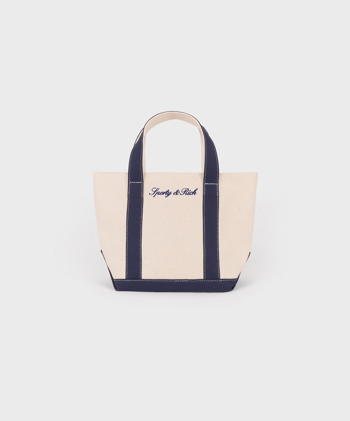 스포티앤리치(SPORTY&RICH) 세리프 로고 미니 토트백 - 내추럴/네이비 R265AOB005