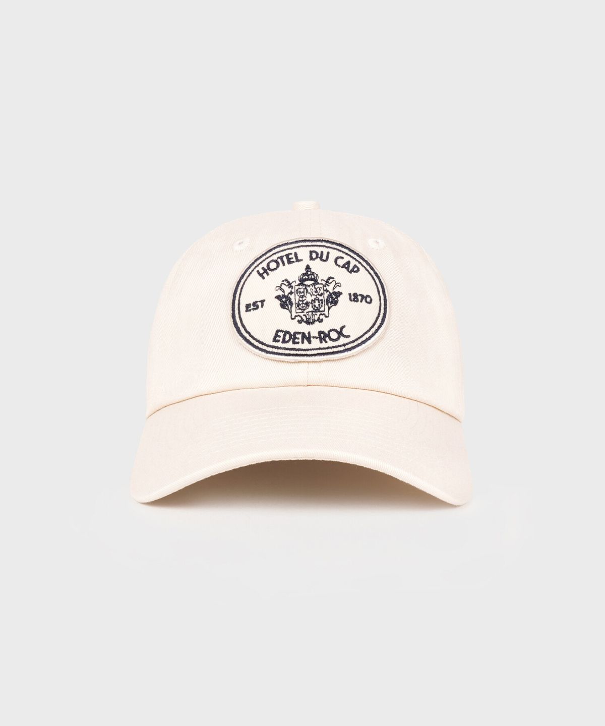 스포티앤리치(SPORTY&RICH) 에덴 크레스트 모자 - 크림 R255AIH013