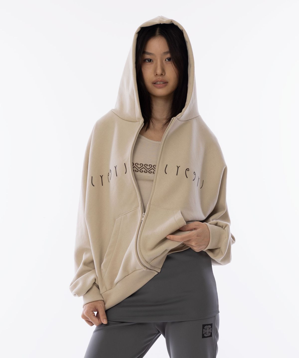 라이라이(LYELYE) LYEX2 Logo Symbol Loose-Fit Hood Zip Up [Beige]