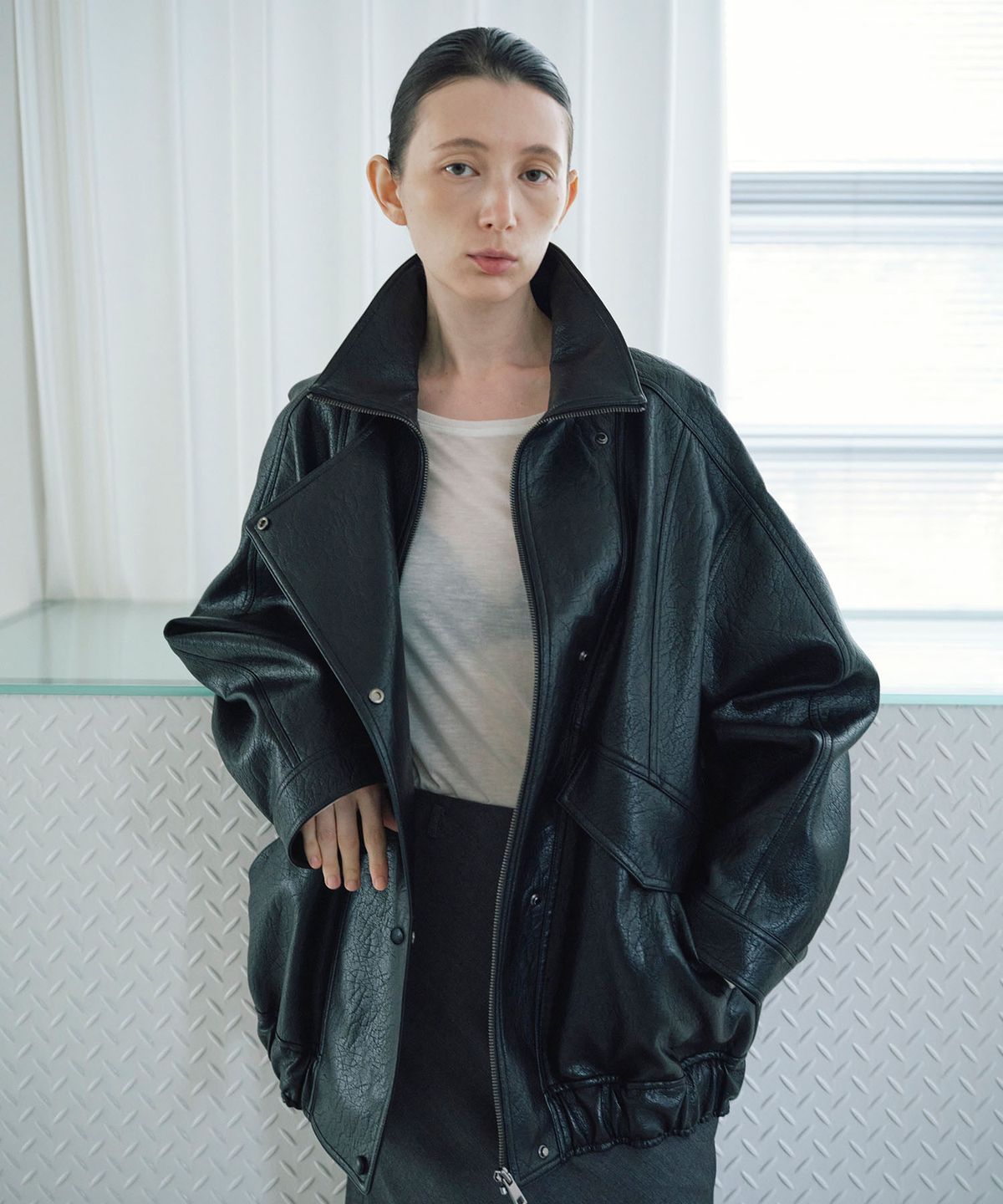 노티아(NOTIA) LOOSE FIT HIGH NECK LEATHER JACKET_BLACK