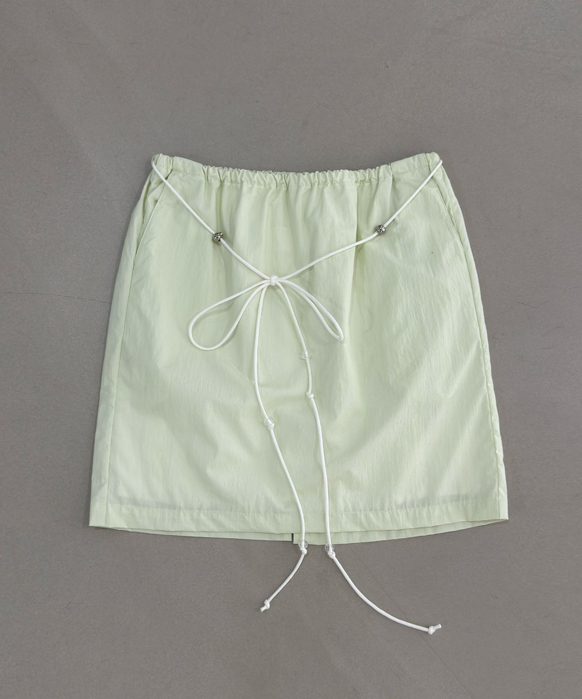 포트레이트서울(PORTRAITSEOUL) 코튼나일론 스트레이트 핏 미디 스커트 - 오이 민트(cucumber mint)