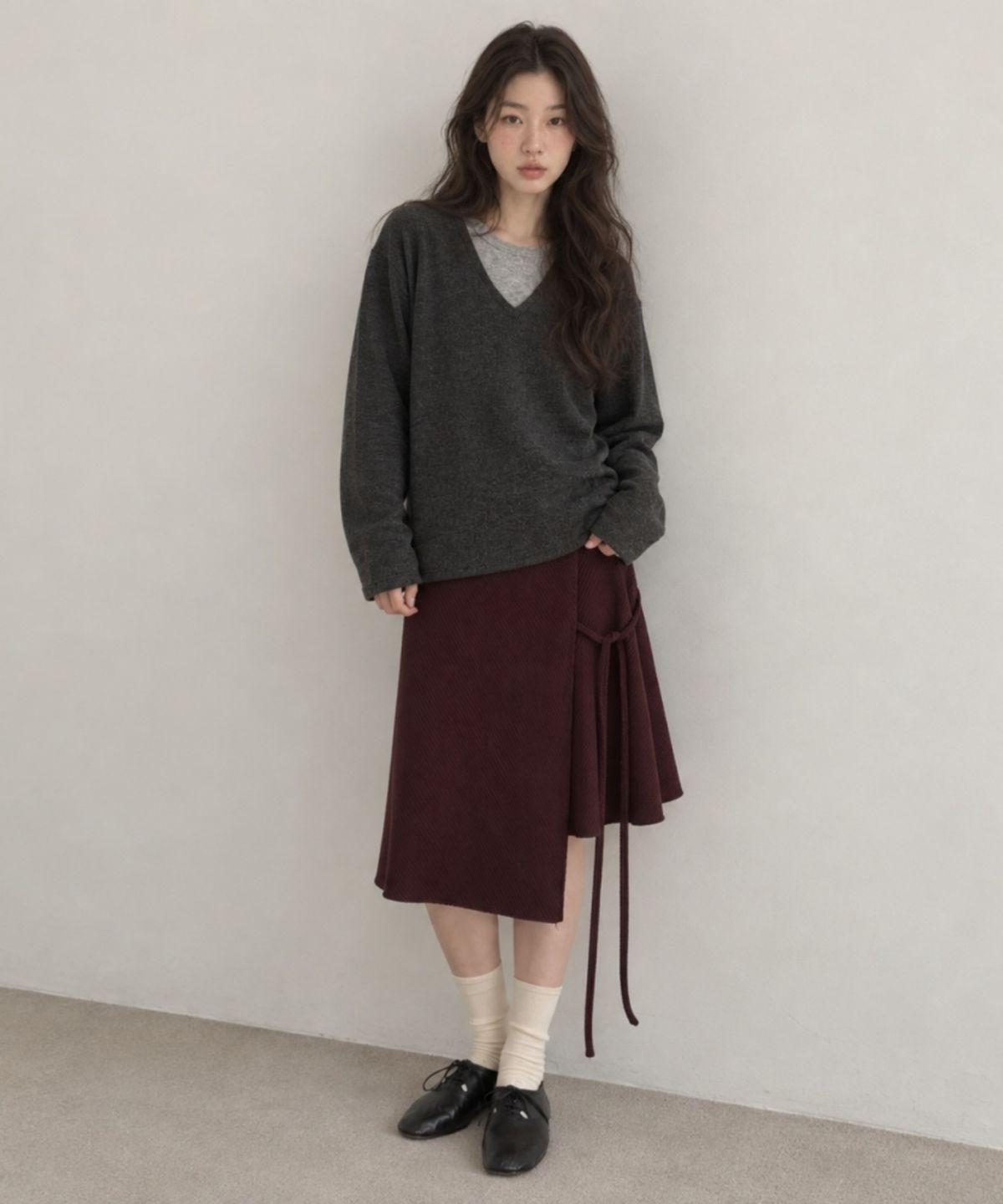 넌즈시(NUNZSI) 컬러 블록 버튼 랩 스커트 플럼