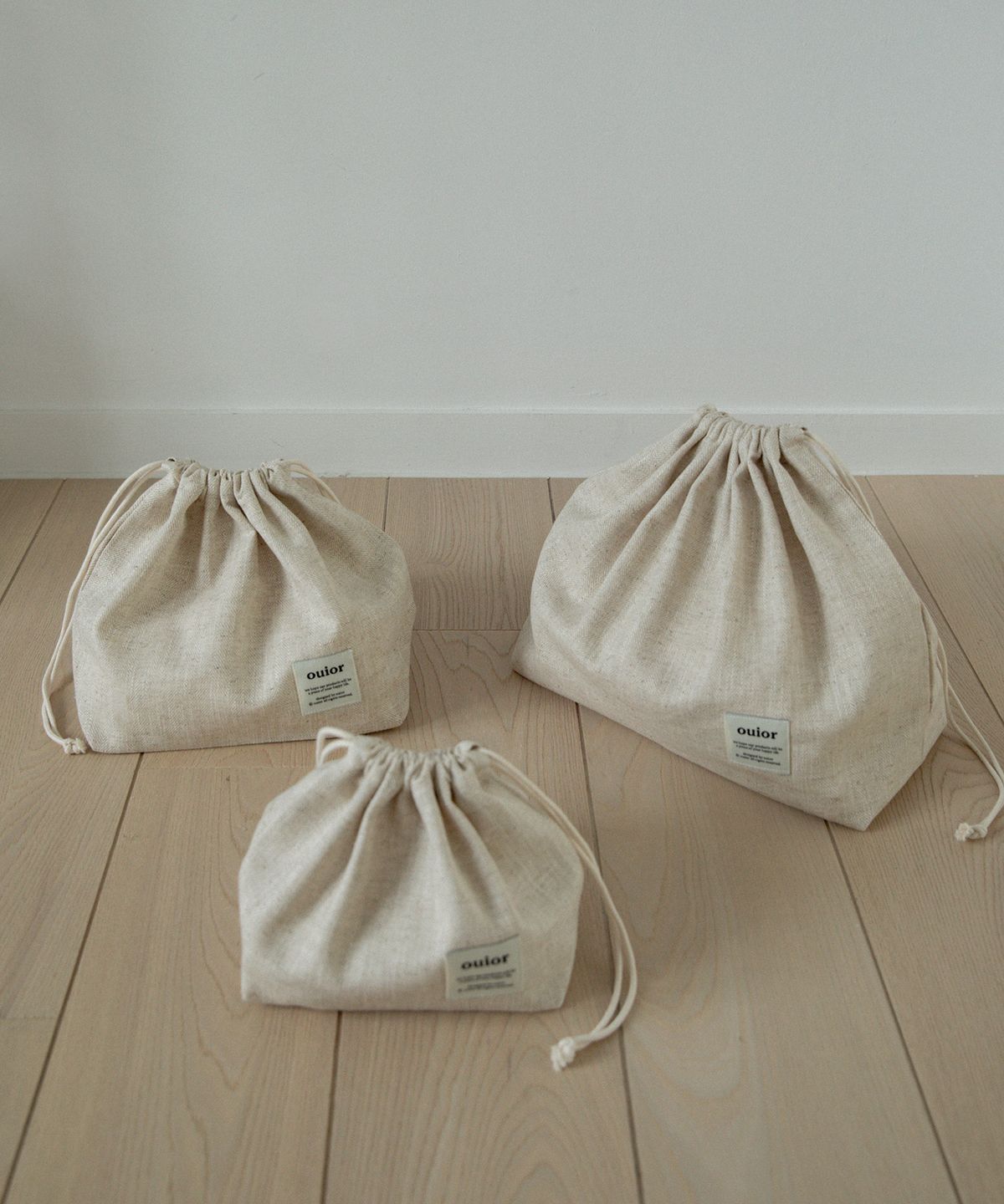 위올(OUIOR) [기프트박스]ouior chubby string pouch_herringbone beige