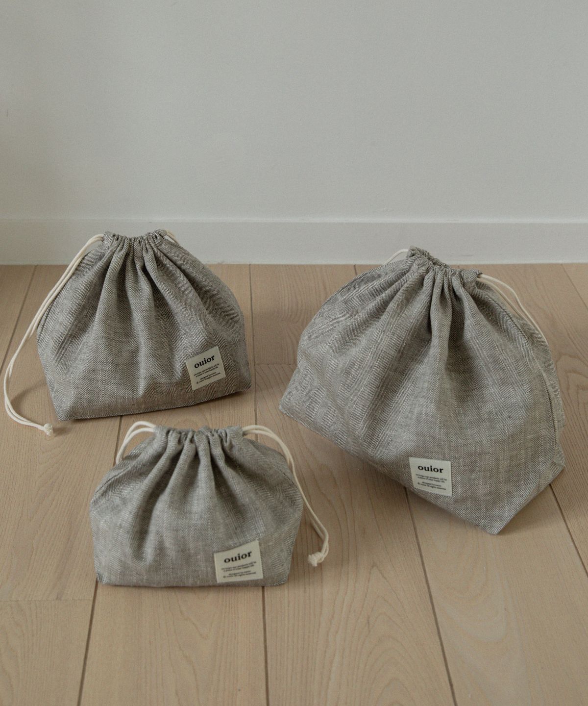 위올(OUIOR) [기프트박스]ouior chubby string pouch_herringbone khaki brown