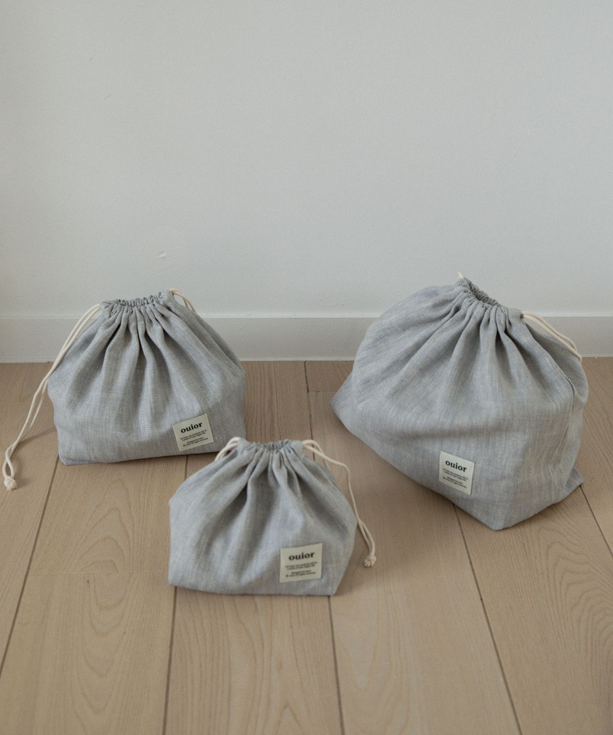 위올(OUIOR) [기프트박스]ouior chubby string pouch_herringbone skygray