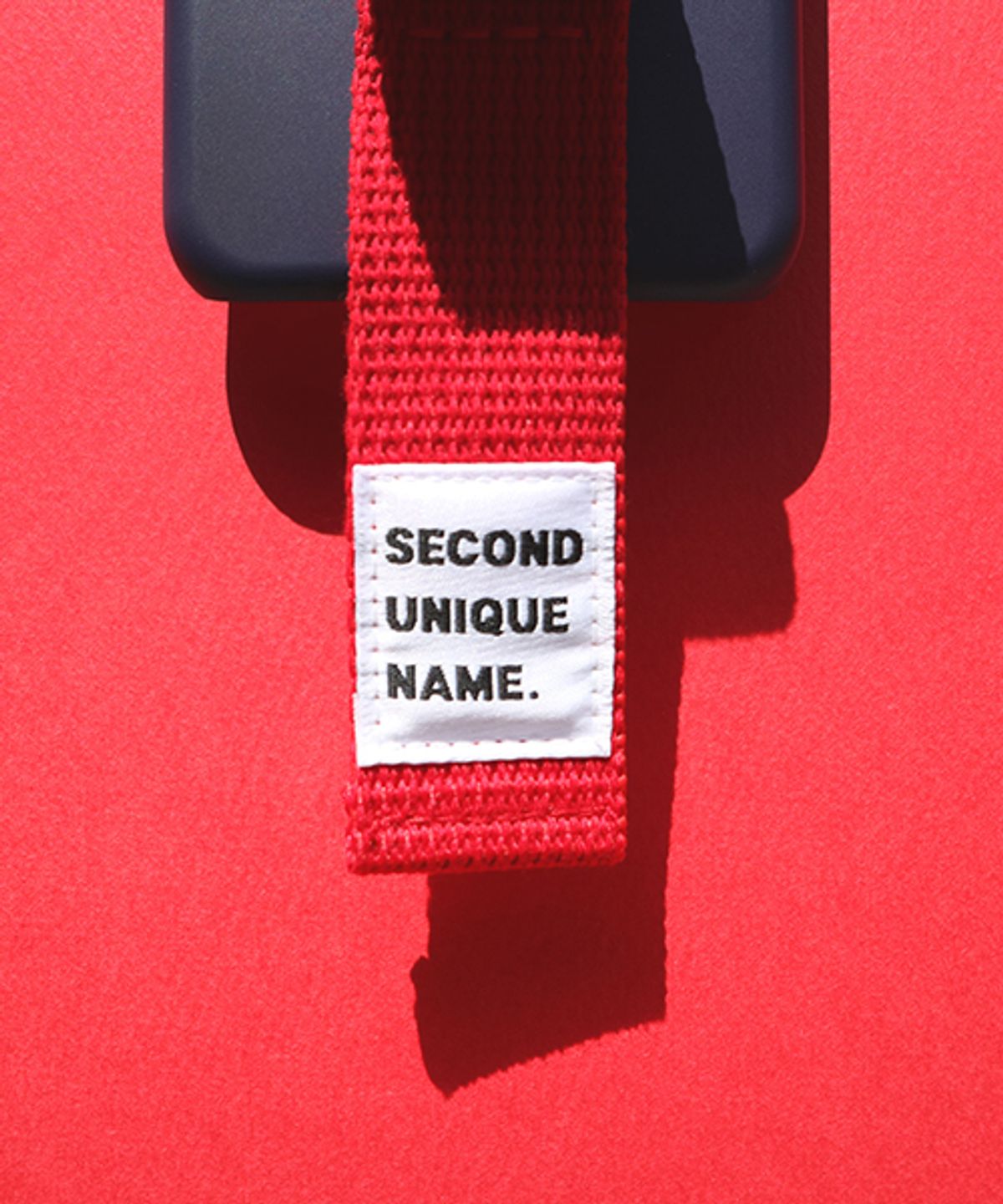 세컨드유니크네임(SECOND UNIQUE NAME) SUN CASE RIBBON NAVY RED