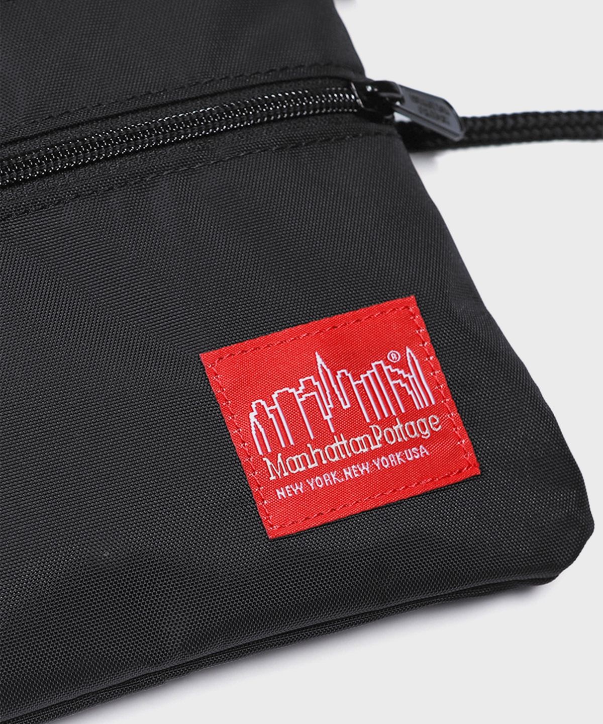 맨하탄 포티지(MANHATTAN PORTAGE) 트리플지퍼 라벨 사코슈백 S BLACK