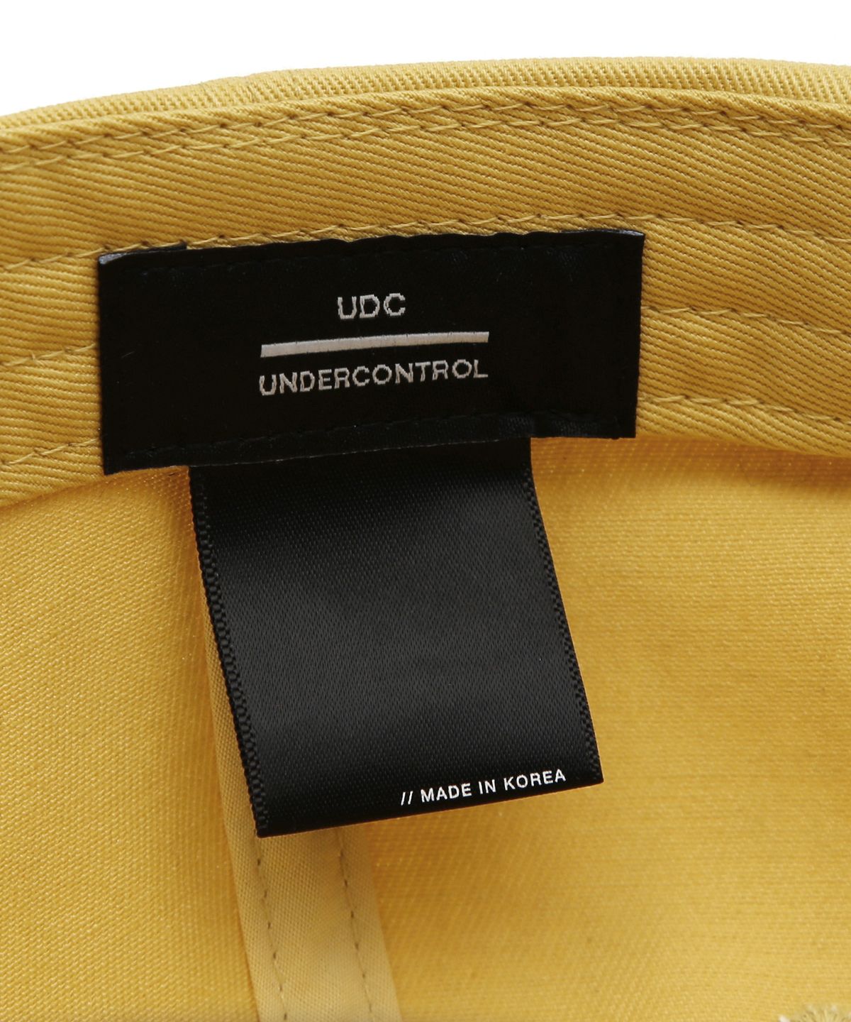 언더컨트롤(UNDERCONTROL) 코튼 로고 볼캡 ES UDC / AUTHENTIC B B / YELLOW NAVY