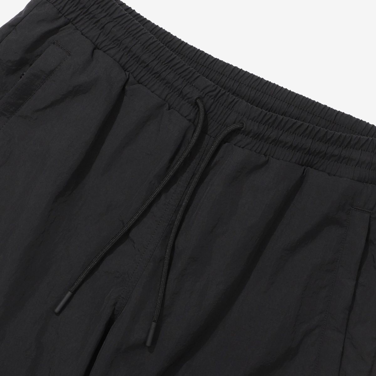 휠라(FILA) 루즈핏 나일론 우븐 조거 팬츠(FS2WPD3210XBLK)