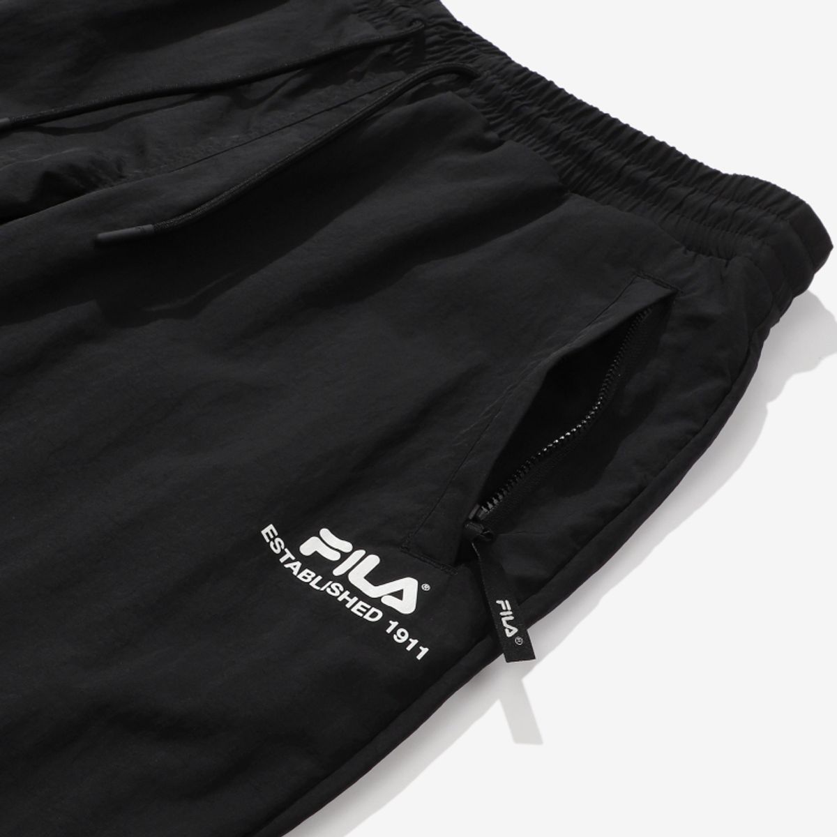 휠라(FILA) 루즈핏 나일론 우븐 조거 팬츠(FS2WPD3210XBLK)