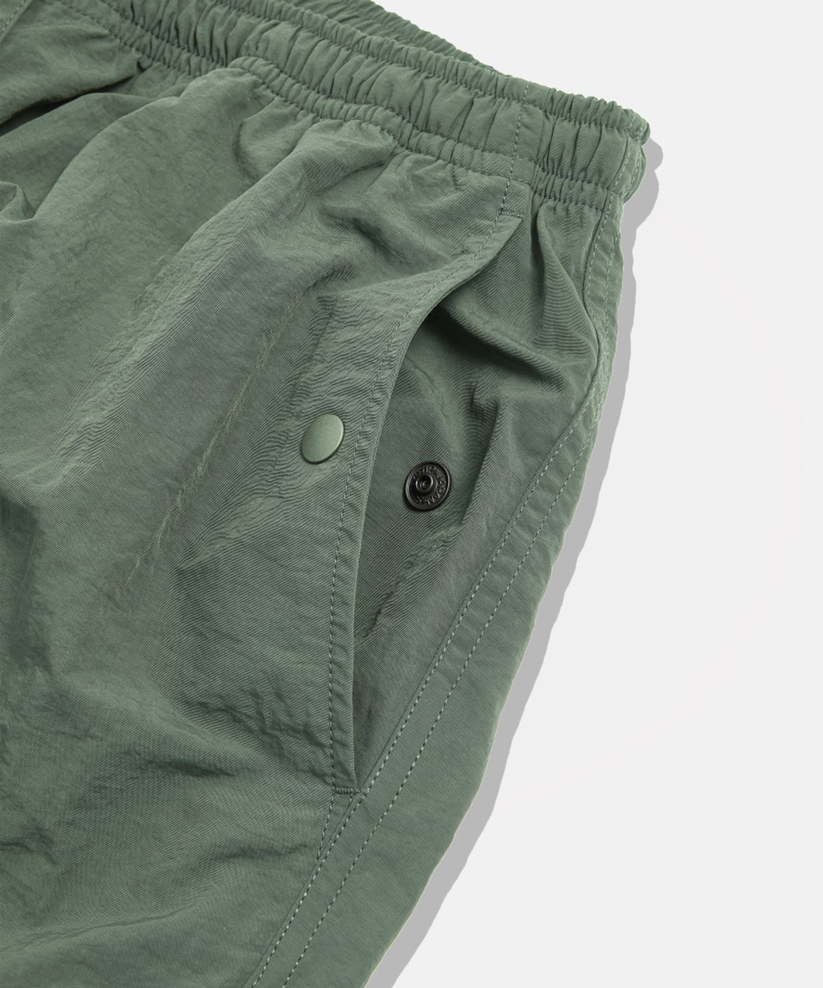 에스피오나지(ESPIONAGE) Nylon Warm Up Pants Olive
