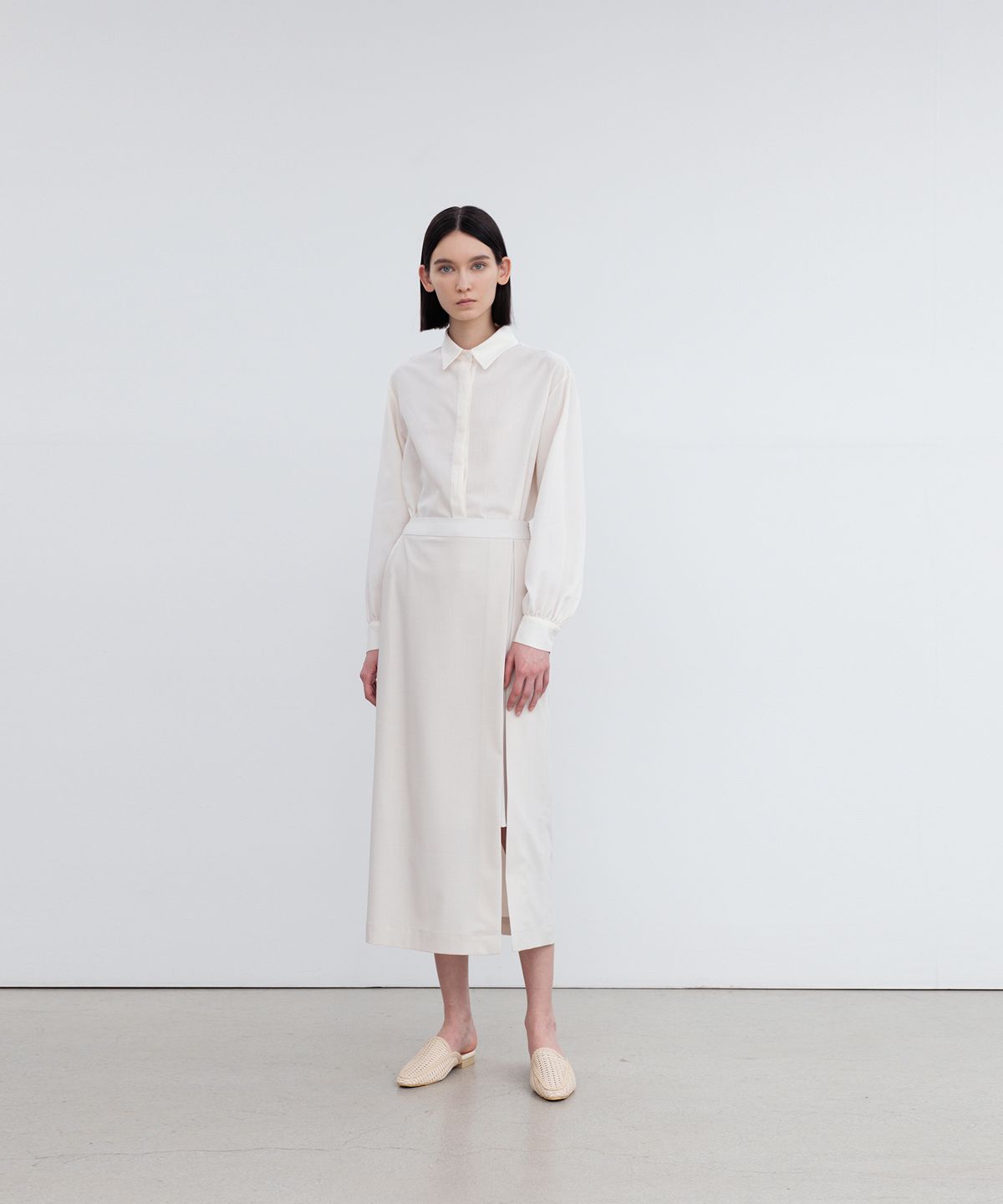 리이(RE RHEE) LAYERED SIDE SLIT MIDI SKIRT