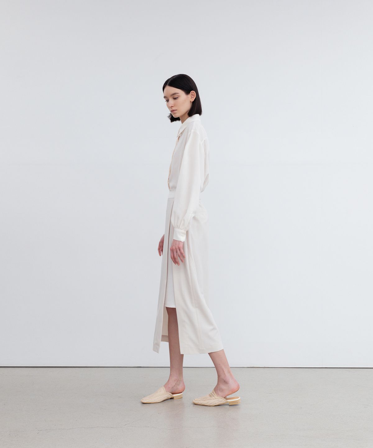 리이(RE RHEE) LAYERED SIDE SLIT MIDI SKIRT