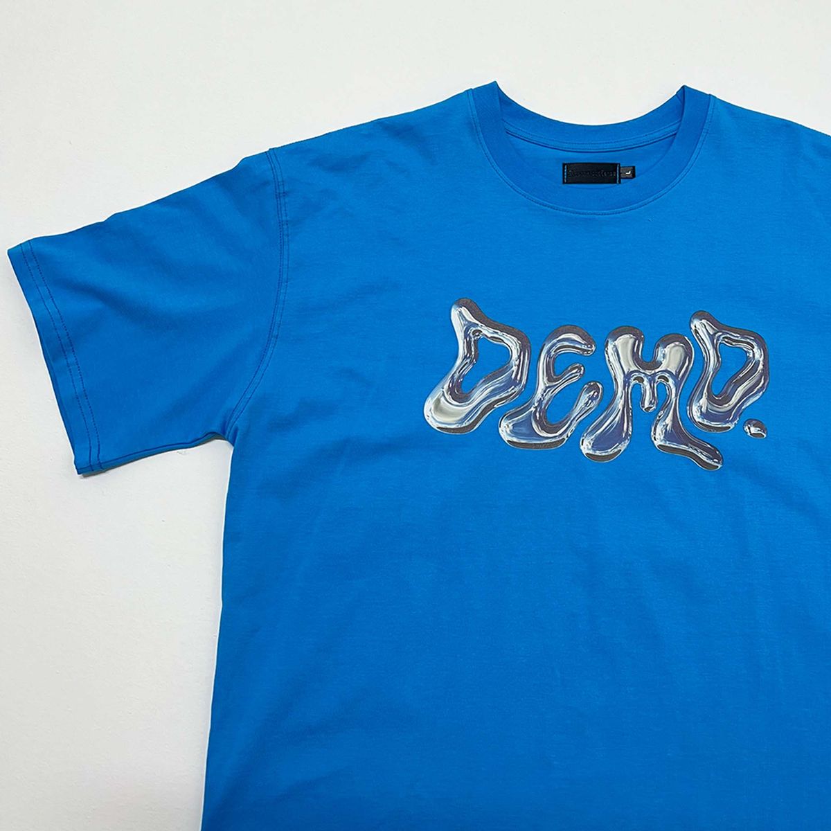 디메이든(DEMADEN) REFLECTED DEMD LOGO 1/2 GRAPHIC T-SHIRT BLUE