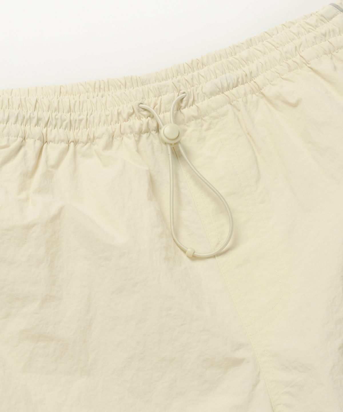 프리즘웍스(FRIZMWORKS) NYLON WINDY SHORTS _ IVORY