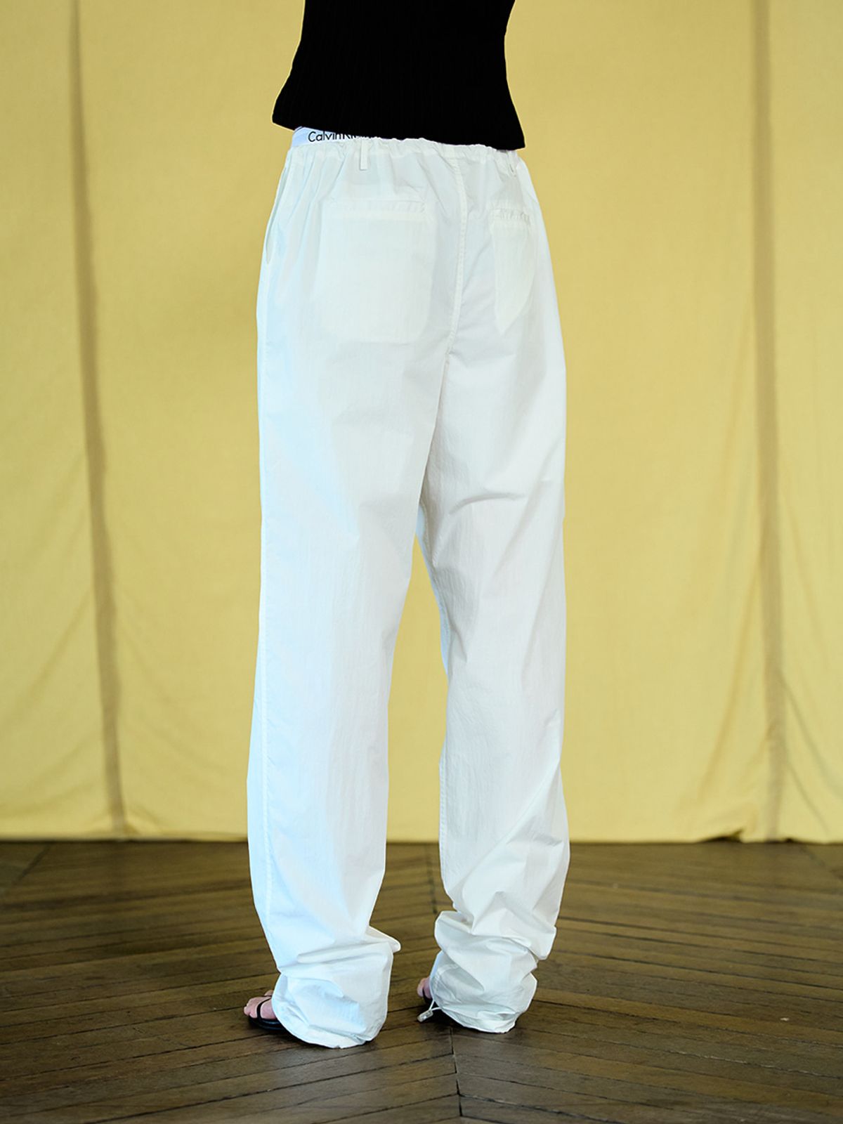 위메농(OUI MAIS NON) Colin low nylon slacks