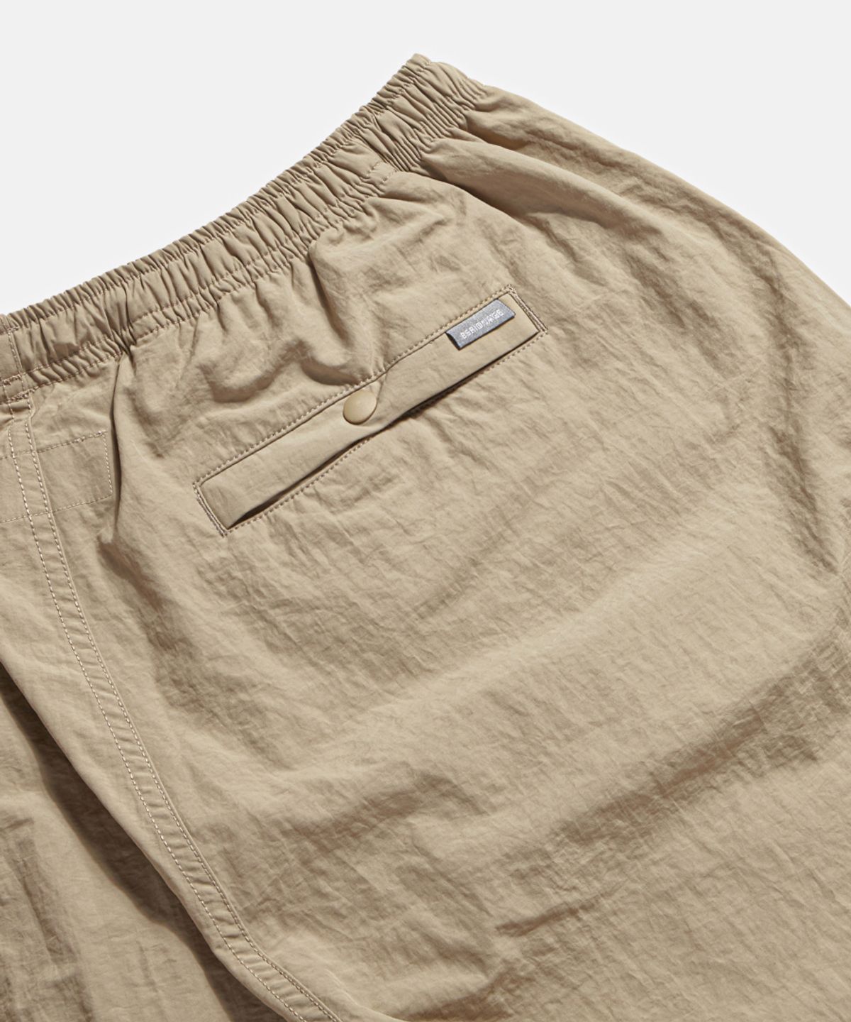 에스피오나지(ESPIONAGE) Nylon Warm Up Pants Desert