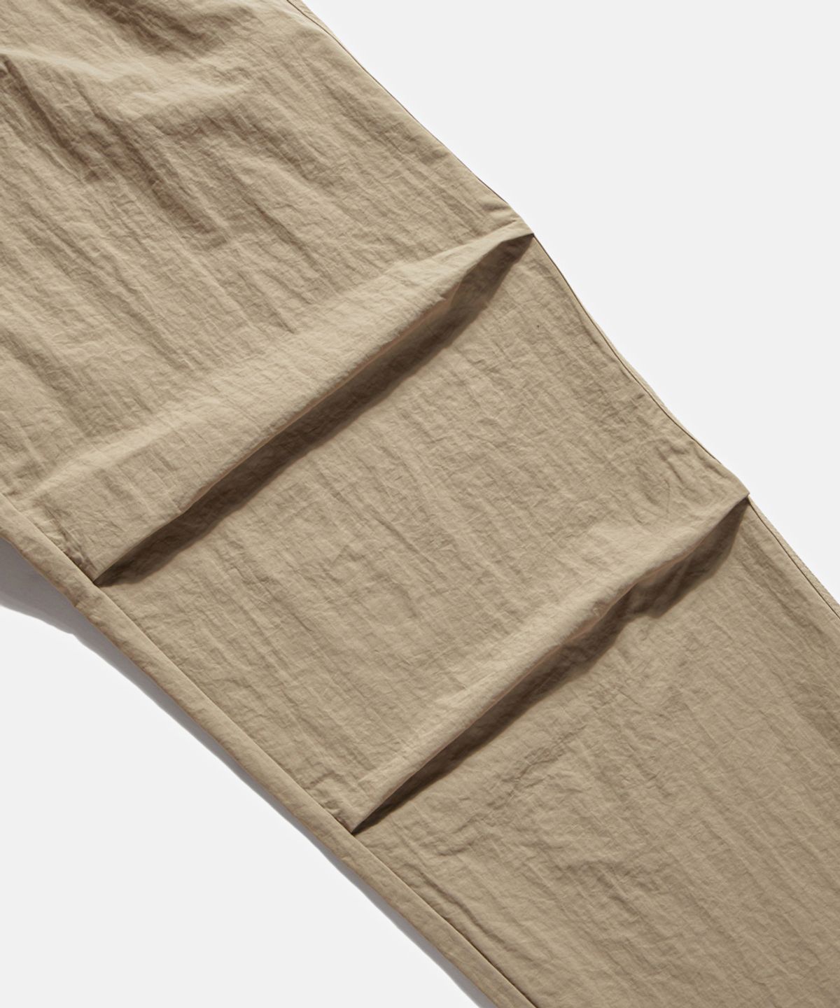 에스피오나지(ESPIONAGE) Nylon Warm Up Pants Desert