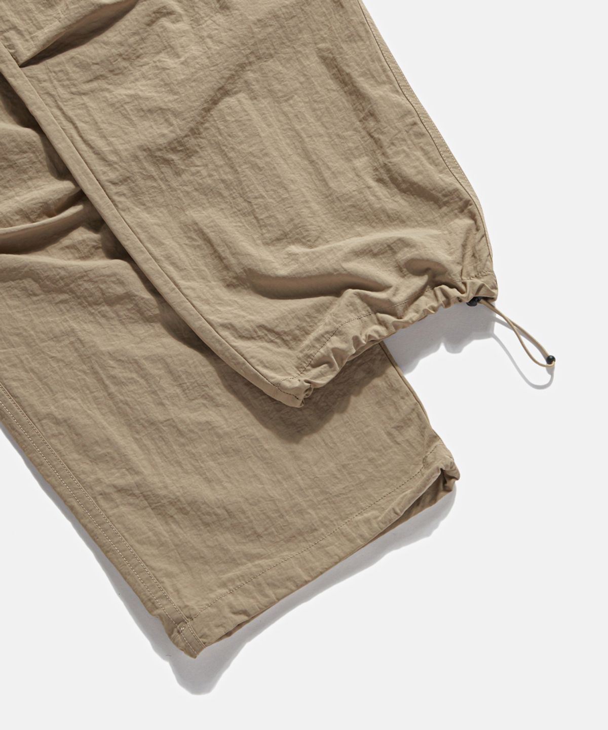 에스피오나지(ESPIONAGE) Nylon Warm Up Pants Desert