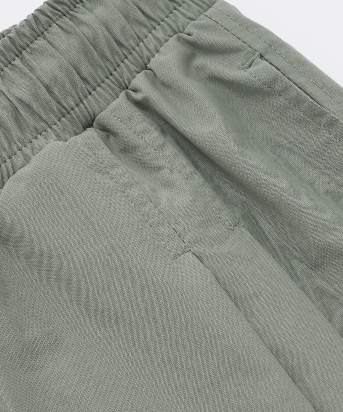 프리즘웍스(FRIZMWORKS) CRISPY NYLON TWO TUCK PANTS _ SAGE GREEN
