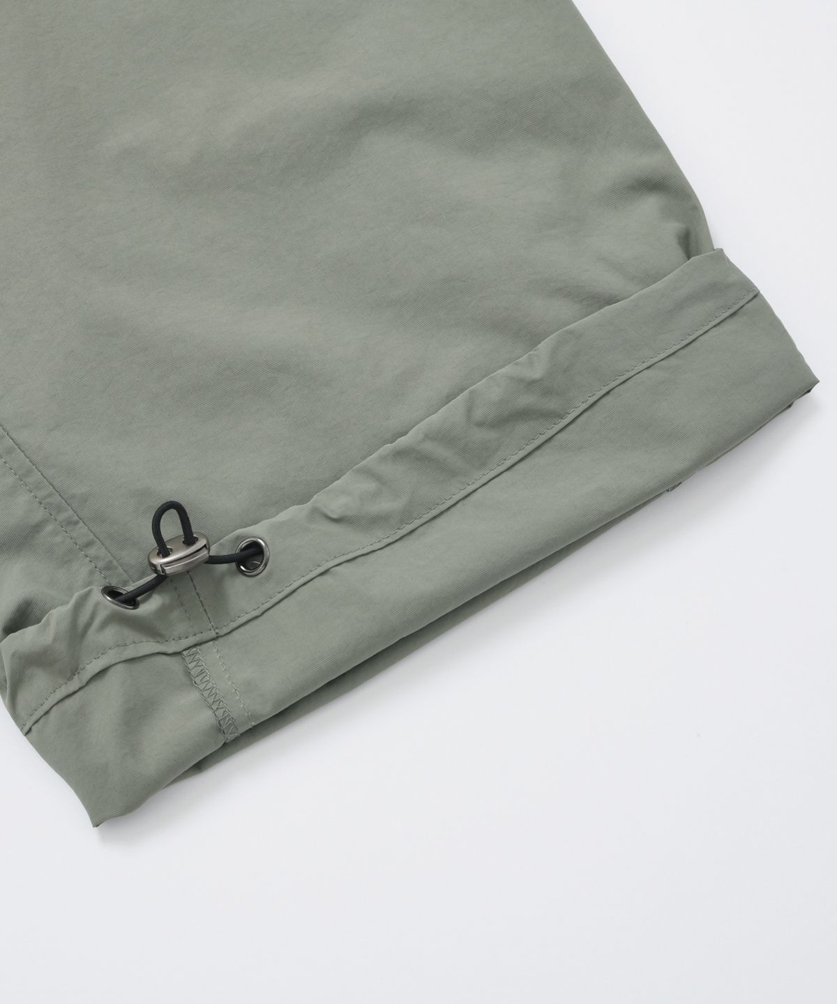 프리즘웍스(FRIZMWORKS) CRISPY NYLON TWO TUCK PANTS _ SAGE GREEN