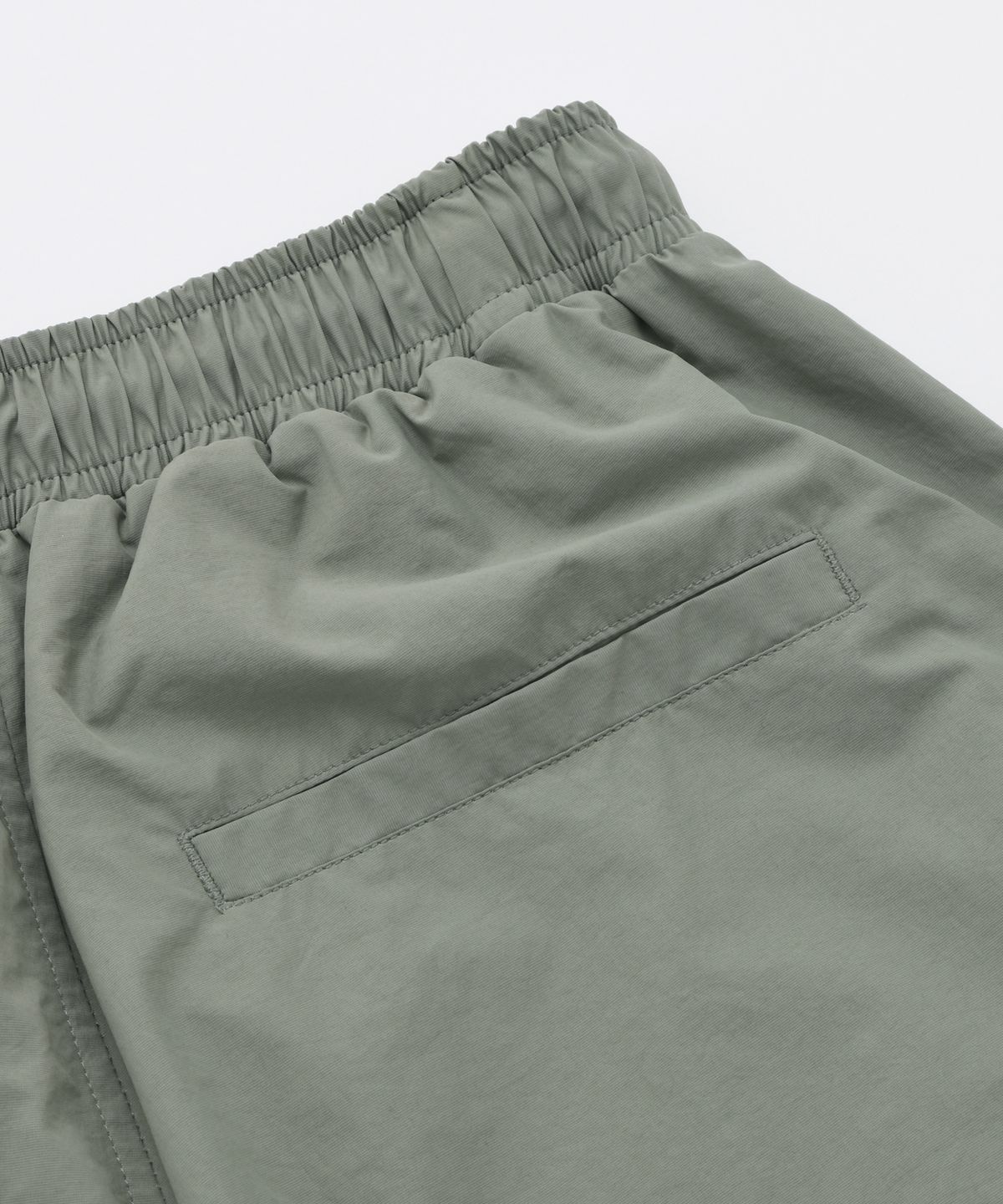 프리즘웍스(FRIZMWORKS) CRISPY NYLON TWO TUCK PANTS _ SAGE GREEN