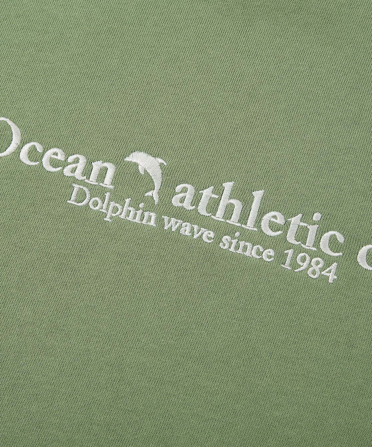 돌핀웨이브어패럴(DOLPHIN WAVE APPAREL) 돌핀 애슬레틱 클럽 맨투맨 페일그린