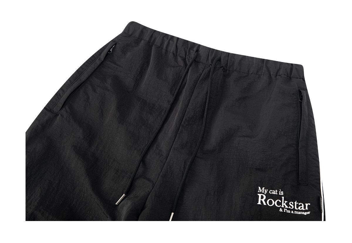 조거쉬(JOEGUSH) My cat is Rockstar Nylon Track pants (Black)
