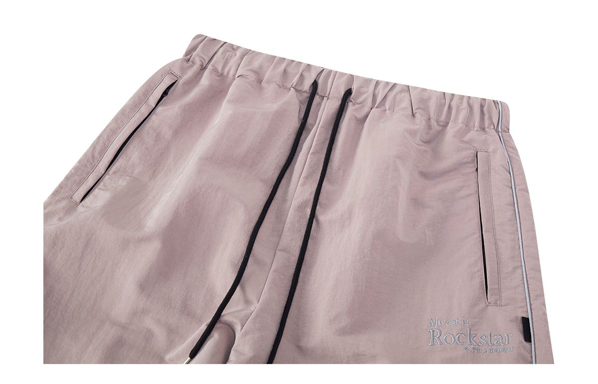 조거쉬(JOEGUSH) My cat is Rockstar Nylon Track pants (Baby Pink)