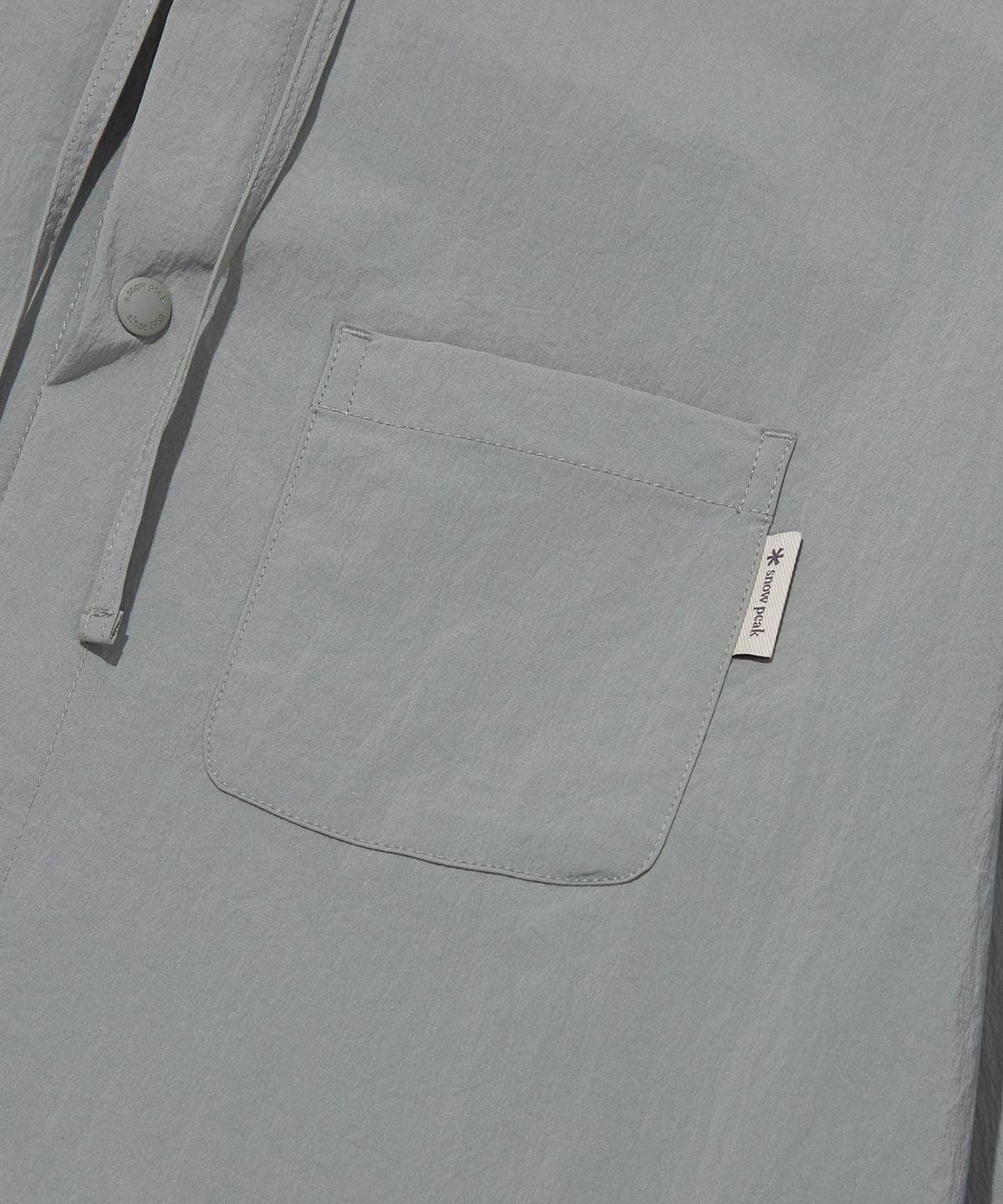스노우피크 어패럴(SNOWPEAK APPAREL) 루트 썬그립 바람막이 Light Khaki (S23MURWB22)