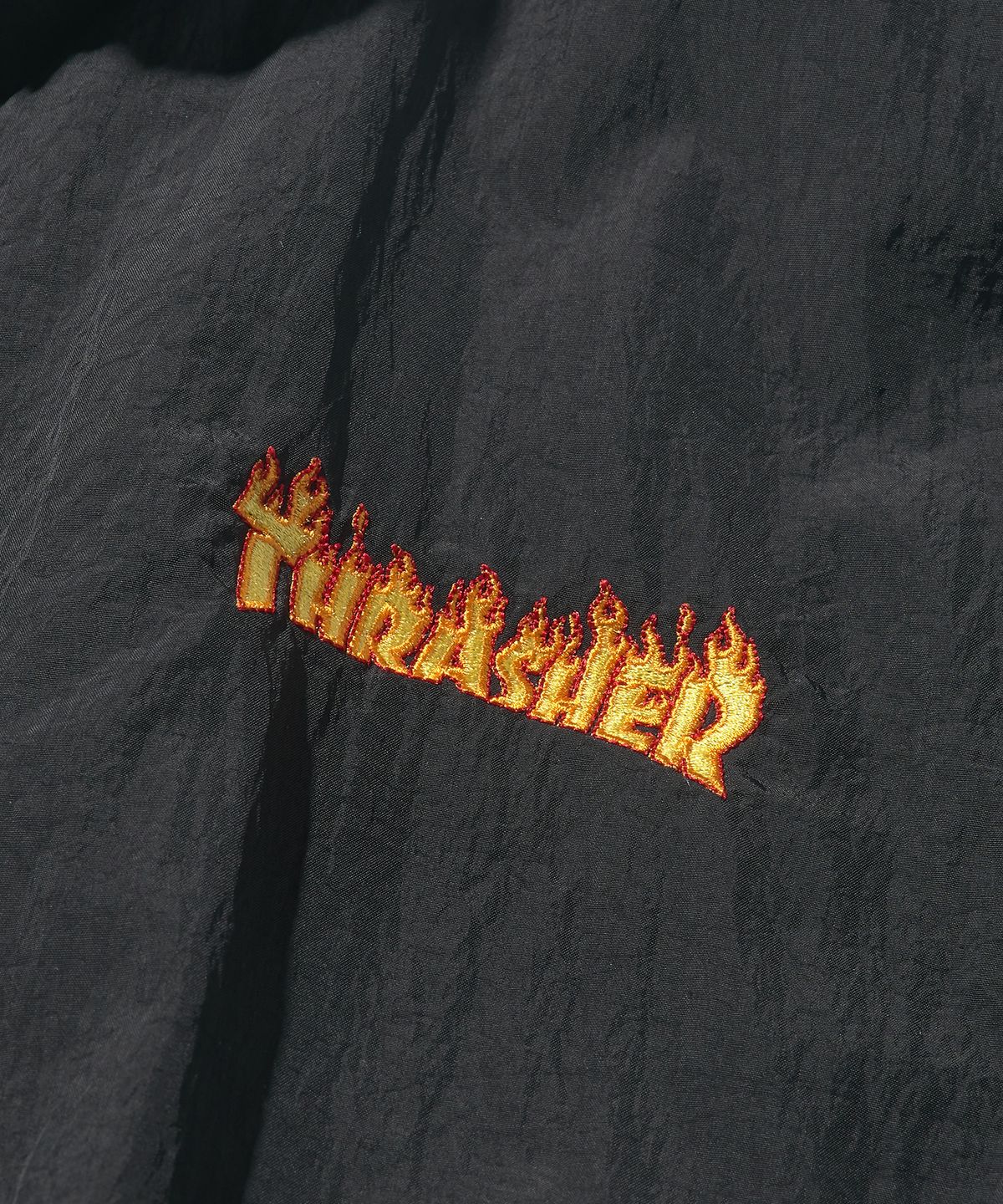 트레셔(THRASHER) 플레임 나일론 트랙 자켓 블랙