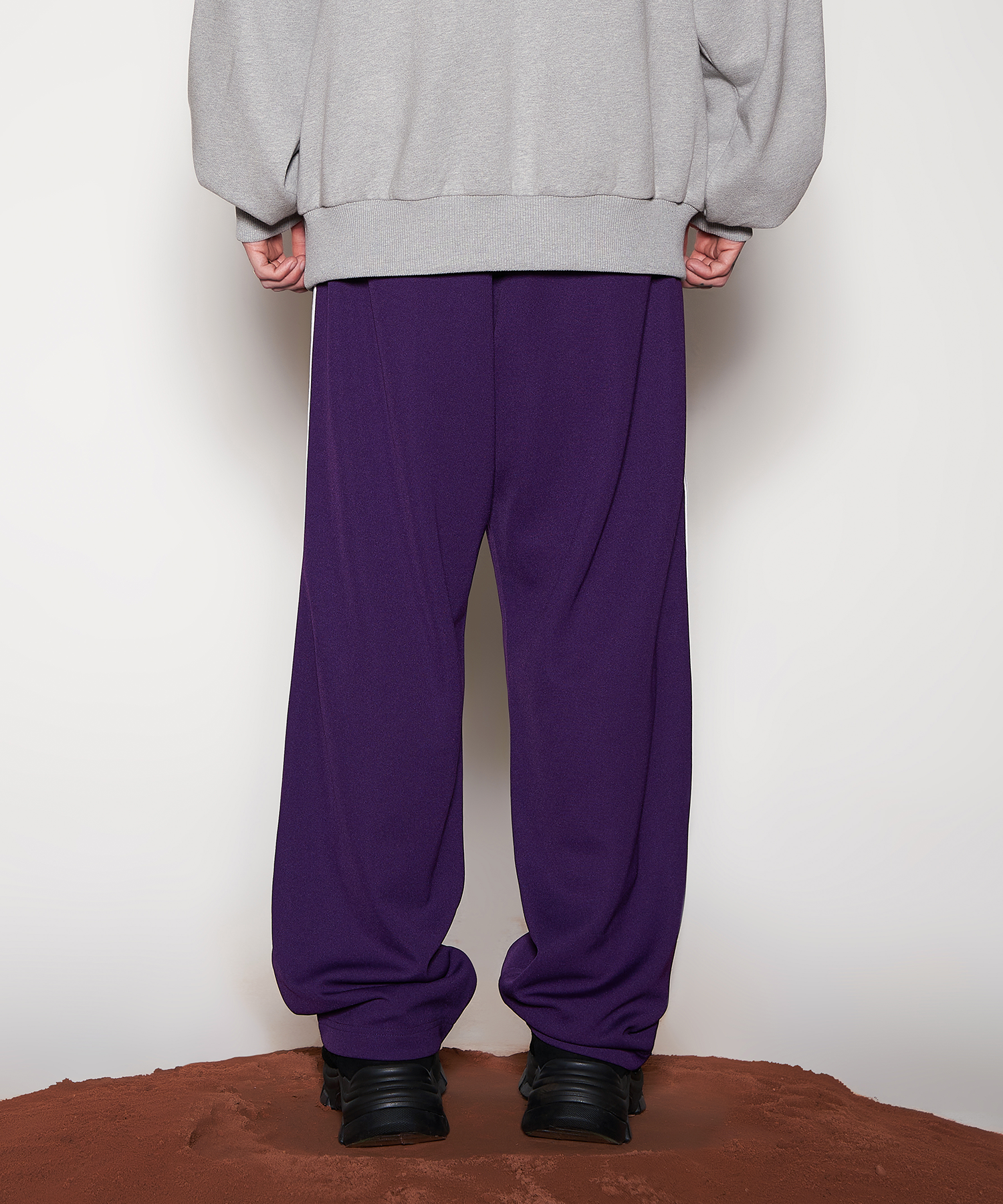 MUSINSA | NERDY Curved Wide Track Pants Dark Purple