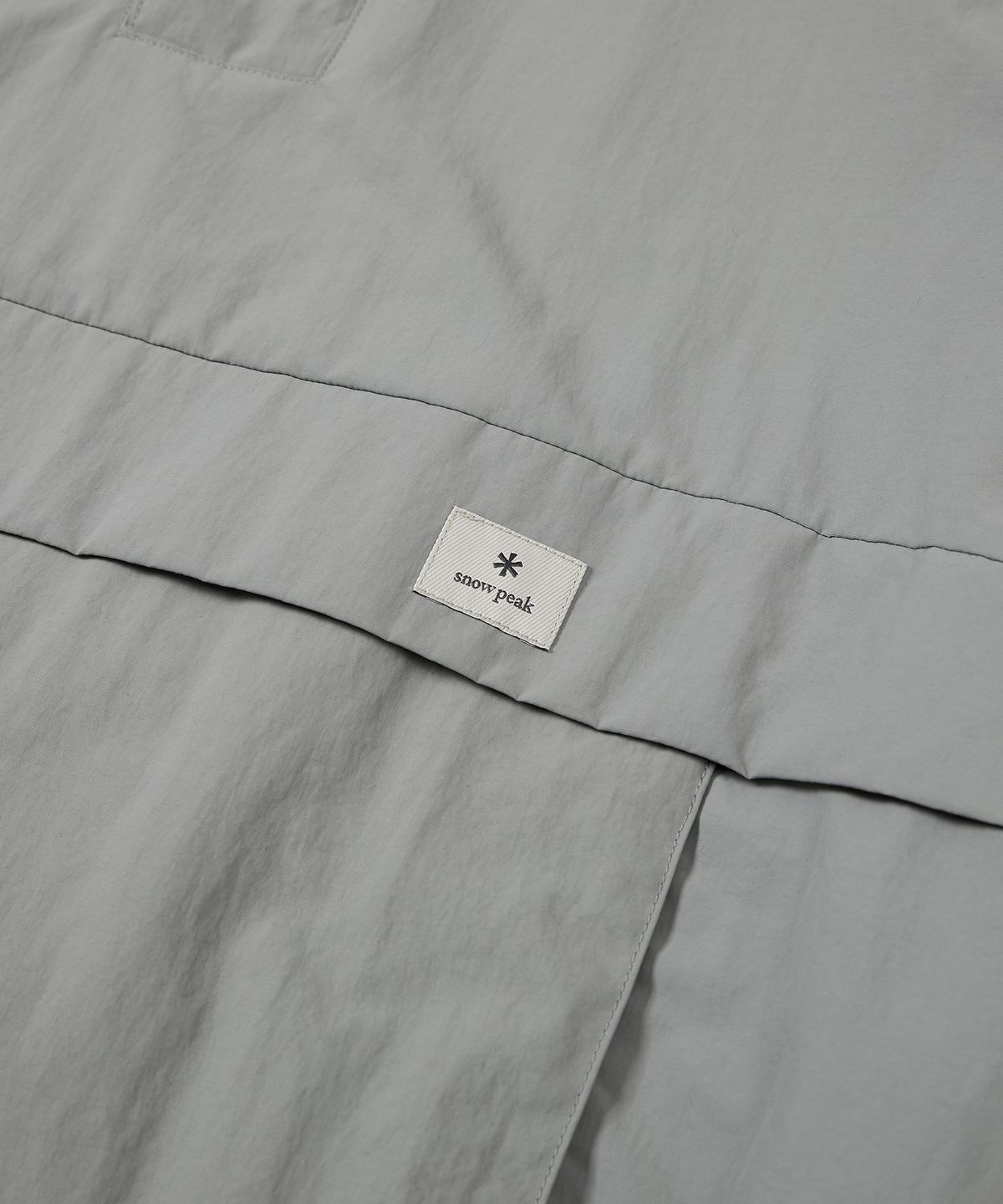 스노우피크 어패럴(SNOWPEAK APPAREL) 캠플 아노락 Light Khaki (S23SUCAN42)