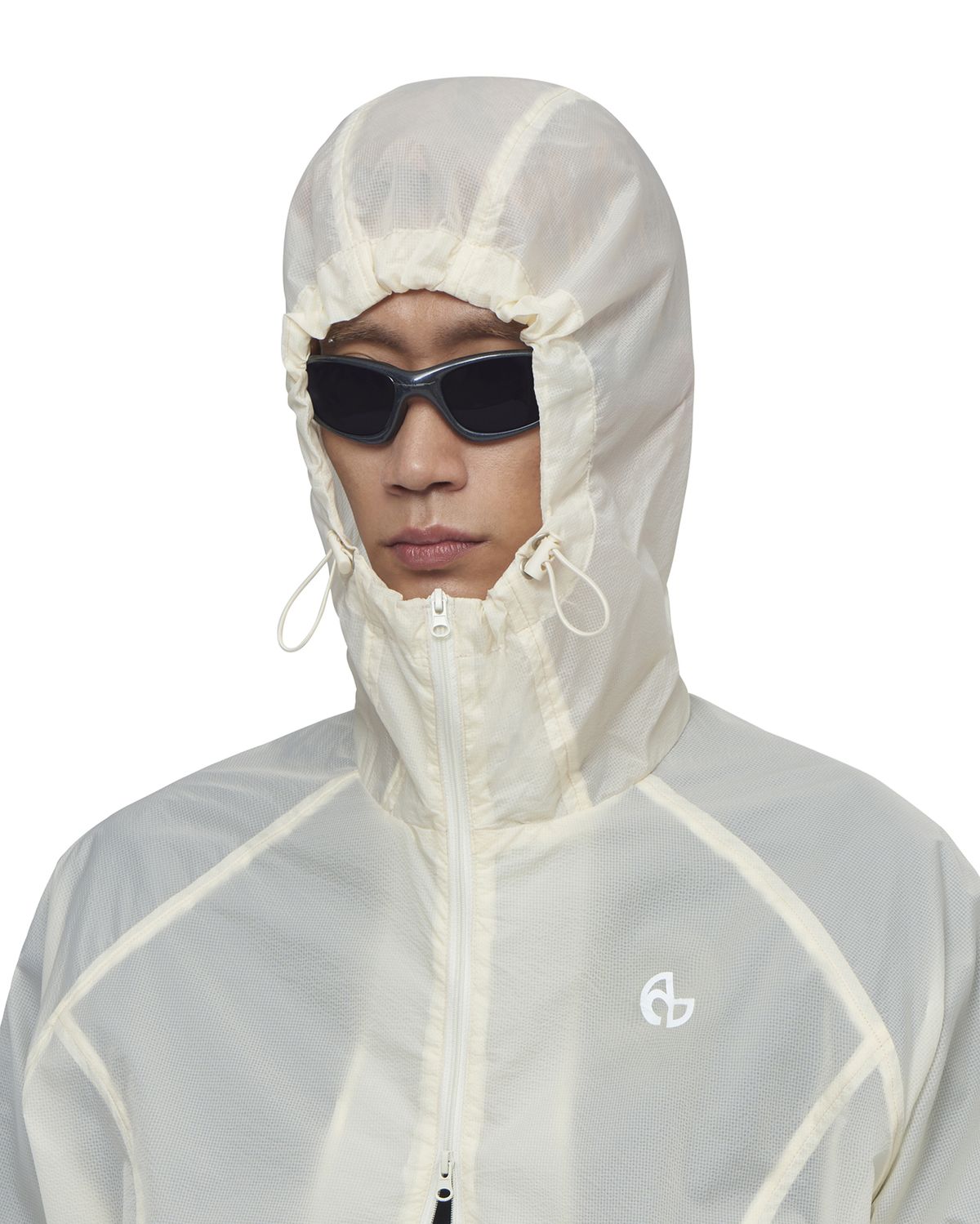 노매뉴얼(NOMANUAL) TRANSLUCENT HOODED JACKET - SAND YELLOW