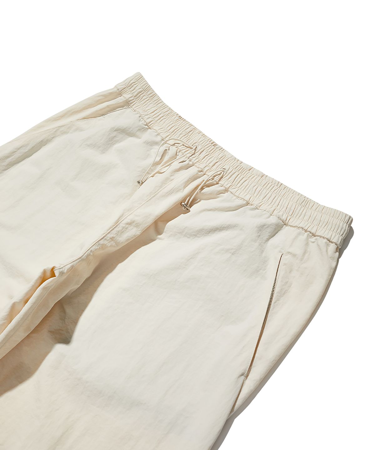 크리틱(CRITIC) Slash Shell Pants Light Beige