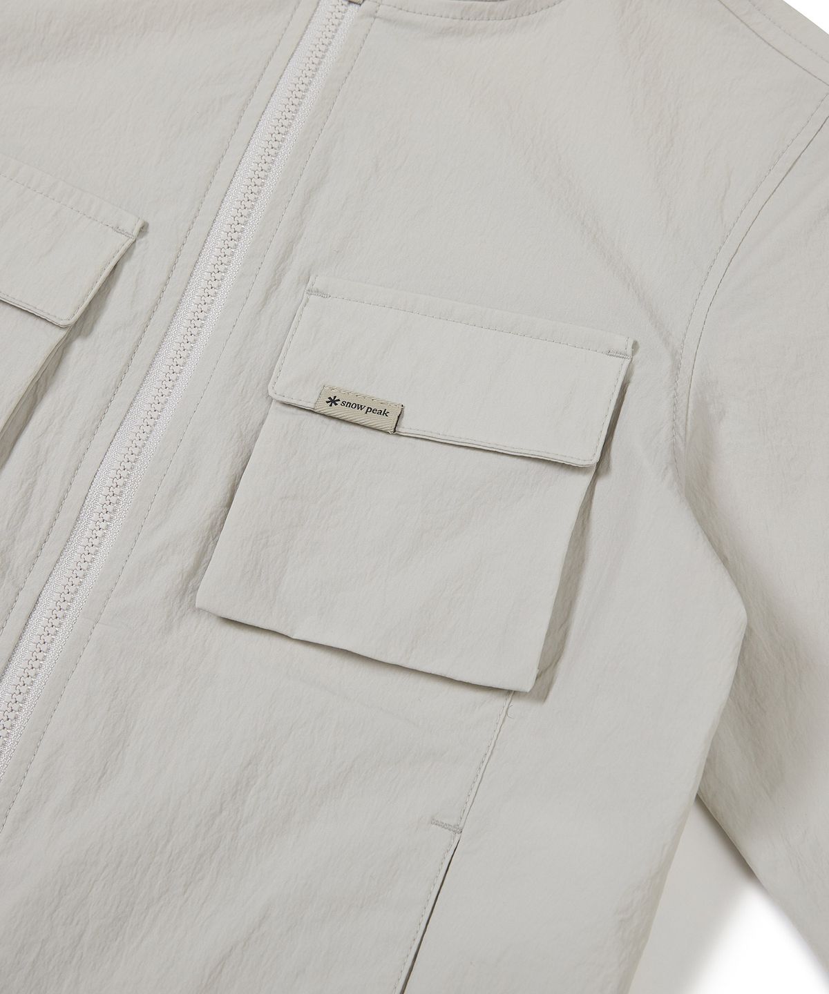 스노우피크 어패럴 키즈(SNOWPEAK APPAREL KIDS) 키즈 루트 아웃포켓 바람막이 Light Beige (S23MKRWB85)