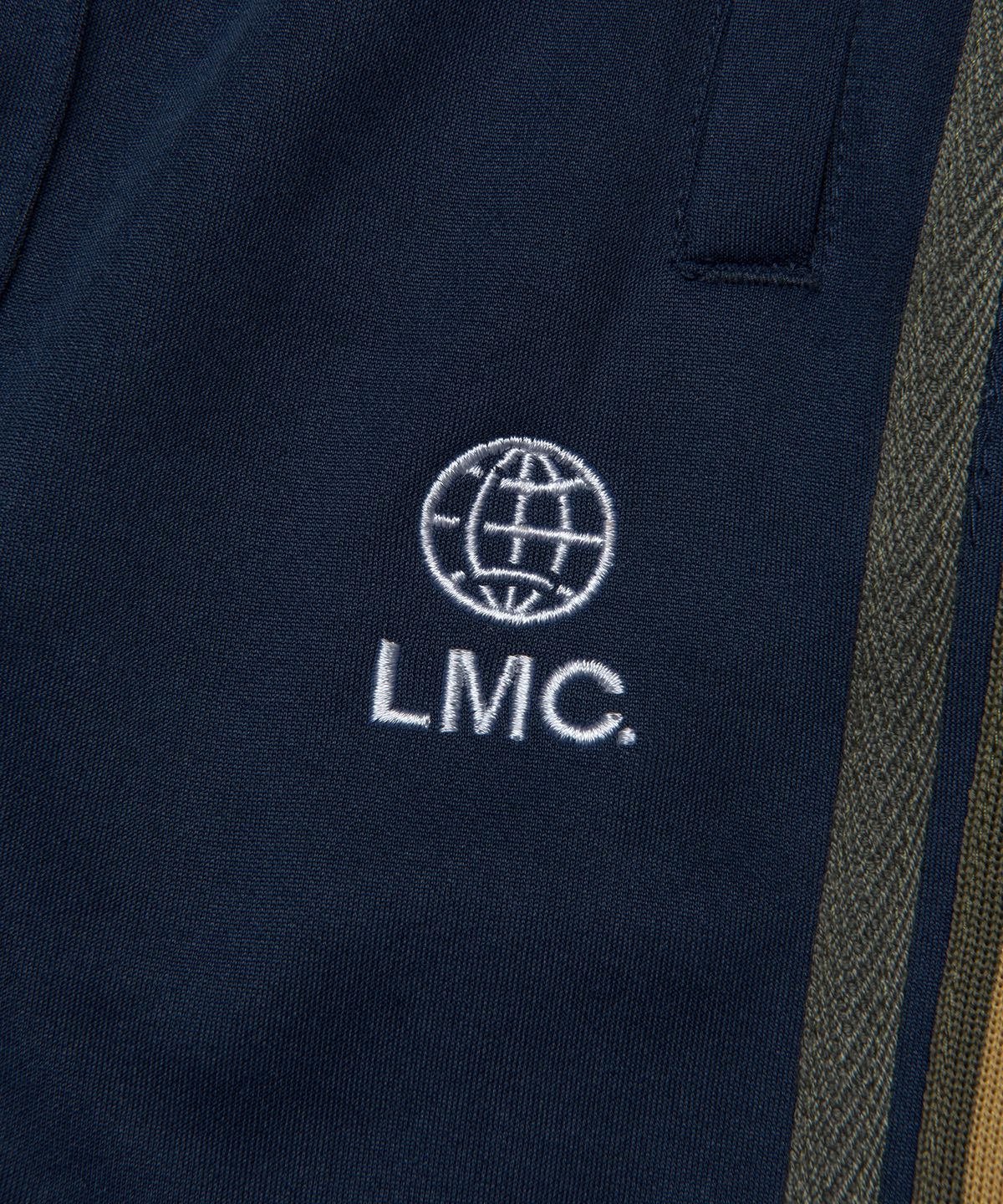 엘엠씨(LMC) SIDE STRIPED JERSEY TRACK PANTS navy