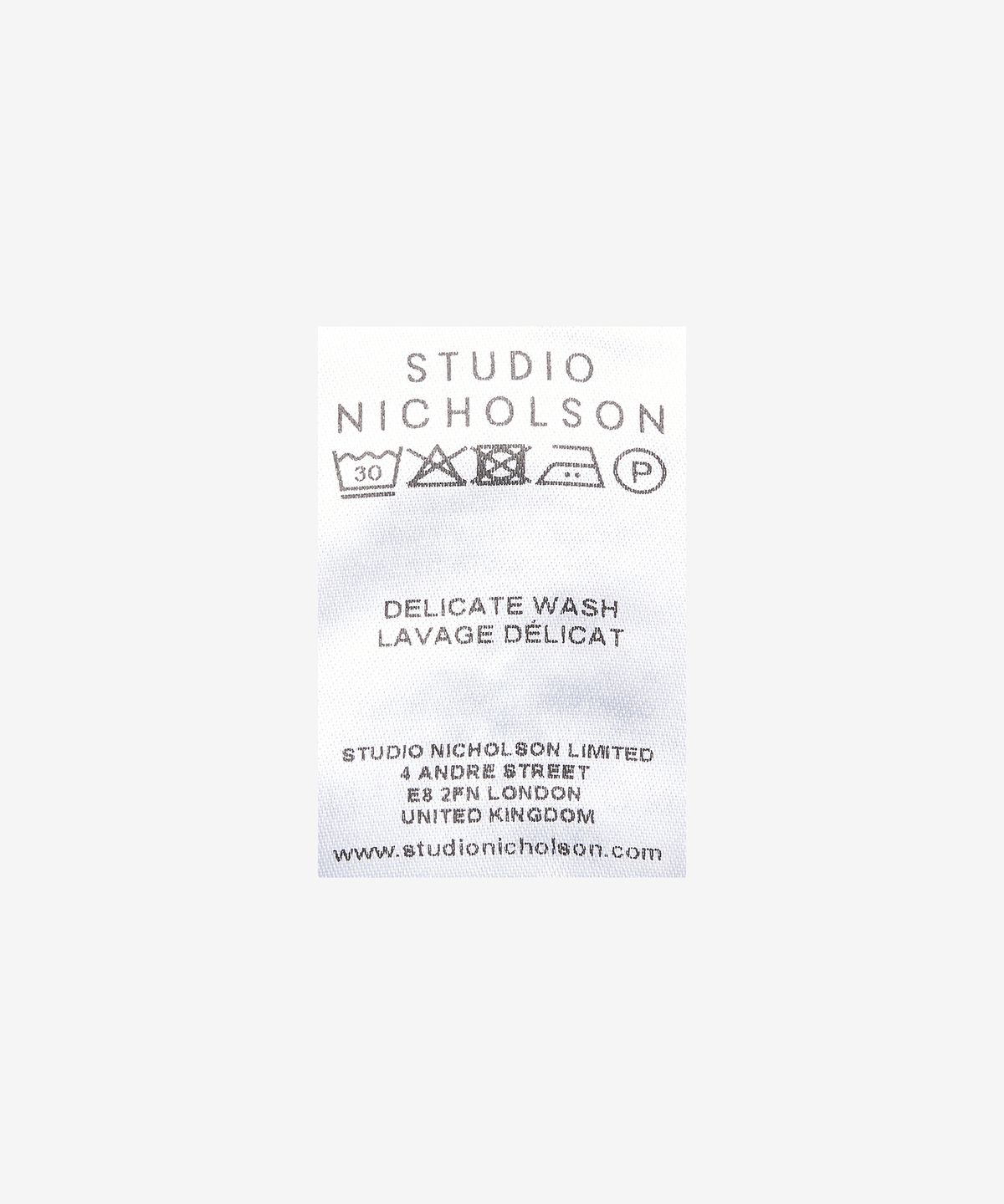 스튜디오니콜슨(STUDIO NICHOLSON) 스피로 플리츠 랩 스커트 - 머스타드 / SPIROSNW989MUSTARD