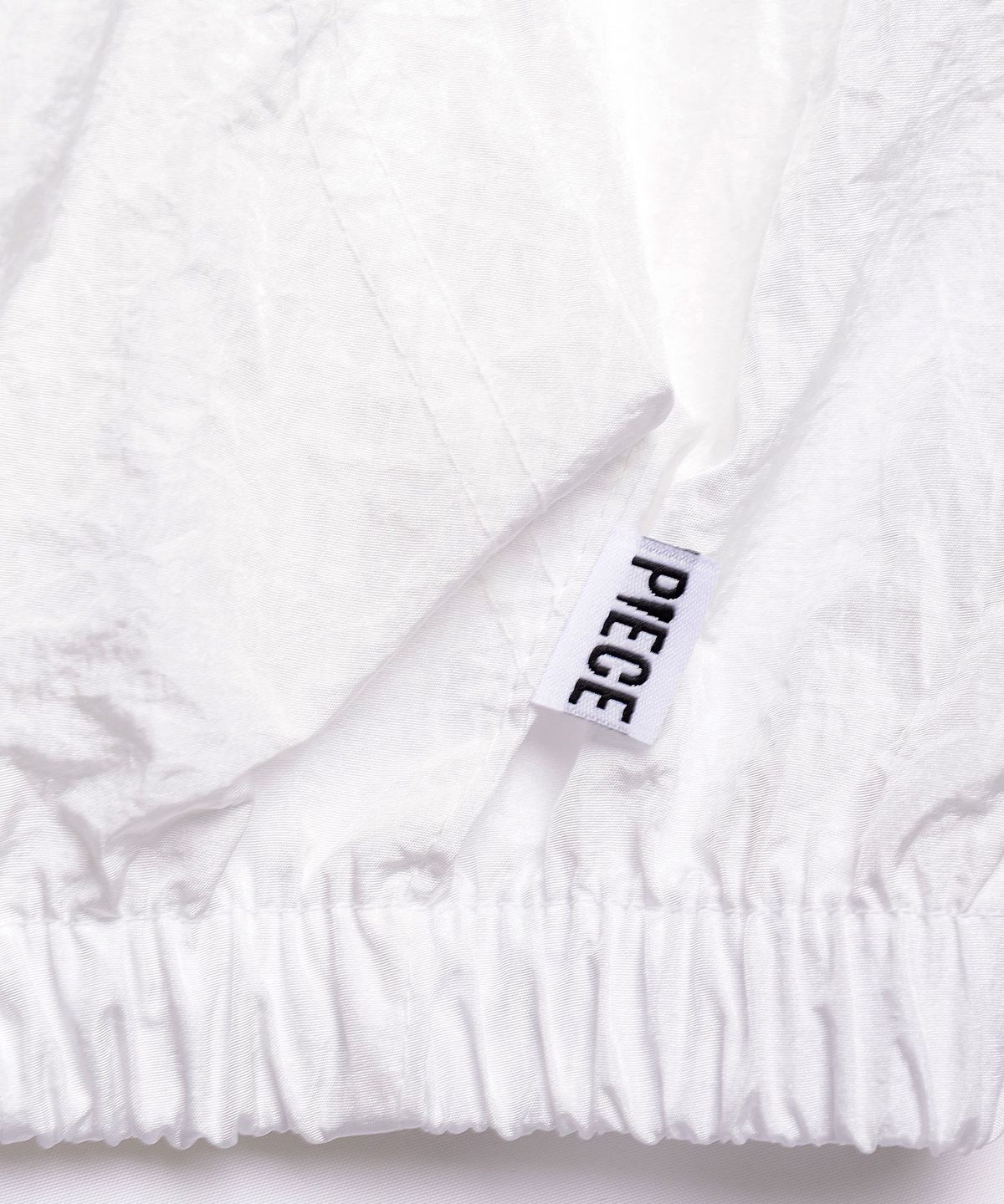 피스메이커(PIECE MAKER) SHIMMERING NYLON TRACK JACKET (IVORY)