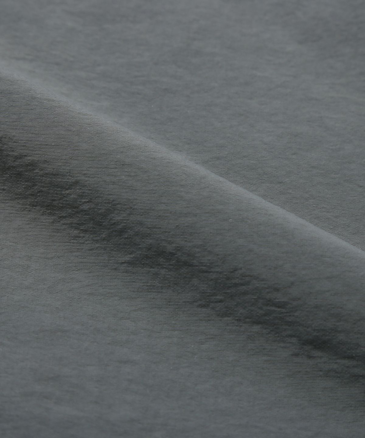 트릴리온(TRILLION) 디비전 나일론 후드 집업 베스트 (CHARCOAL)