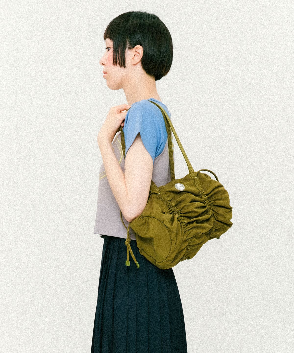 꼬리에(CCORIE) 해머 스트링 숄더백 카키