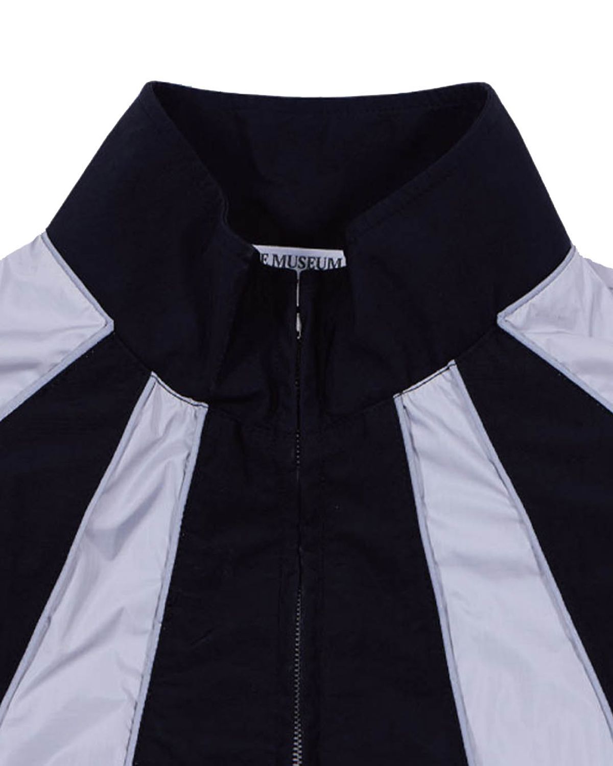 더뮤지엄비지터(THEMUSEUMVISITOR) REFLECTIVE LINE RAGLAN WINDBREAKER (BLACK)