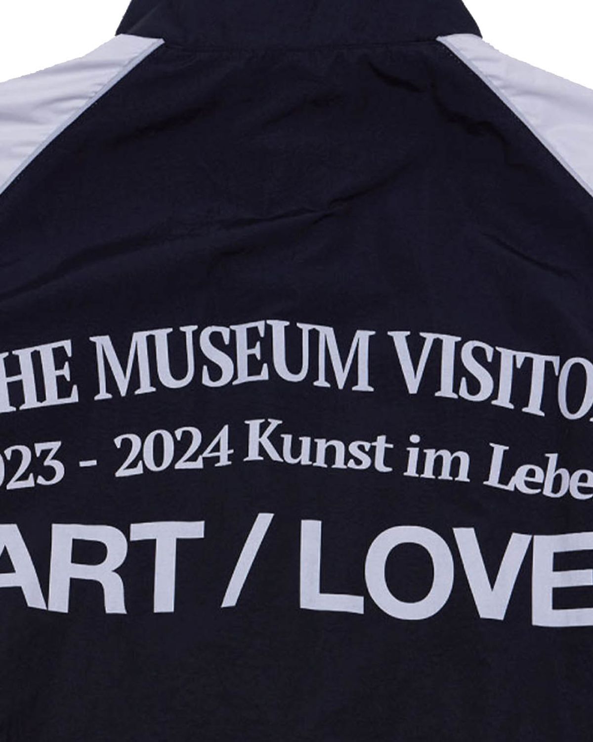 더뮤지엄비지터(THEMUSEUMVISITOR) REFLECTIVE LINE RAGLAN WINDBREAKER (BLACK)