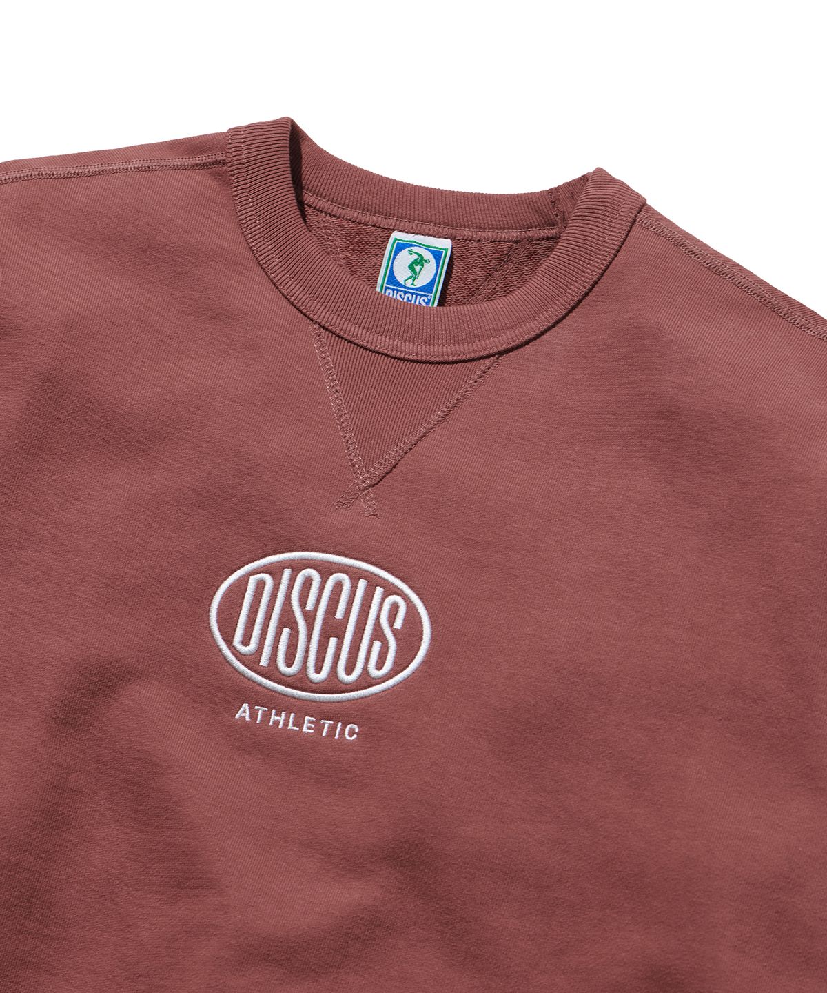 디스커스 애슬레틱(DISCUS ATHLETIC) 헤비웨이트 레귤러 핏 오발 로고 스웨트 셔츠 브릭 레드